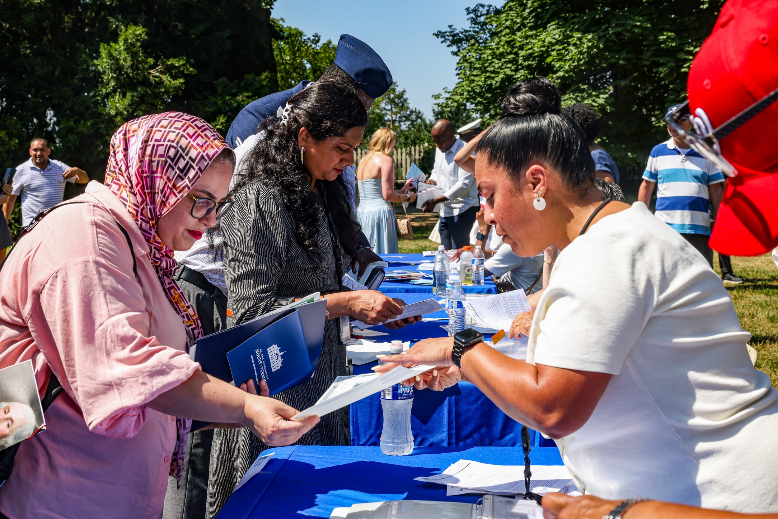 New U.S. citizens receive their naturalization certificate.