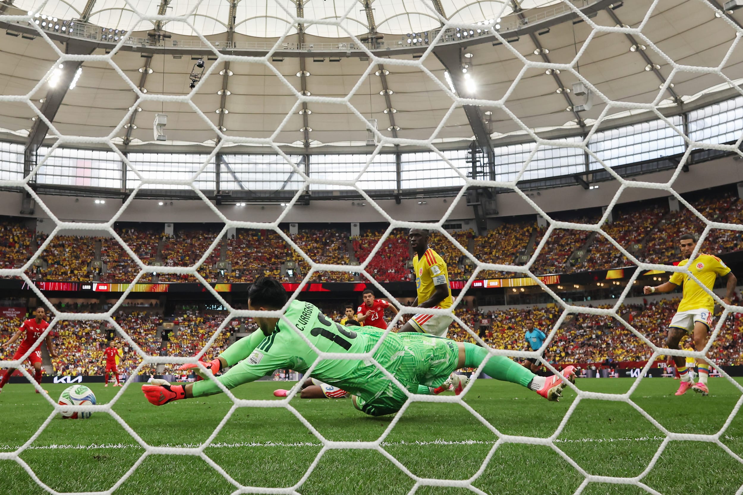 Camilo Vargas #12 of Colombia saves the shot by Zeki Amdouni #23 of Switzerland during the Switzerland v Colombia match.