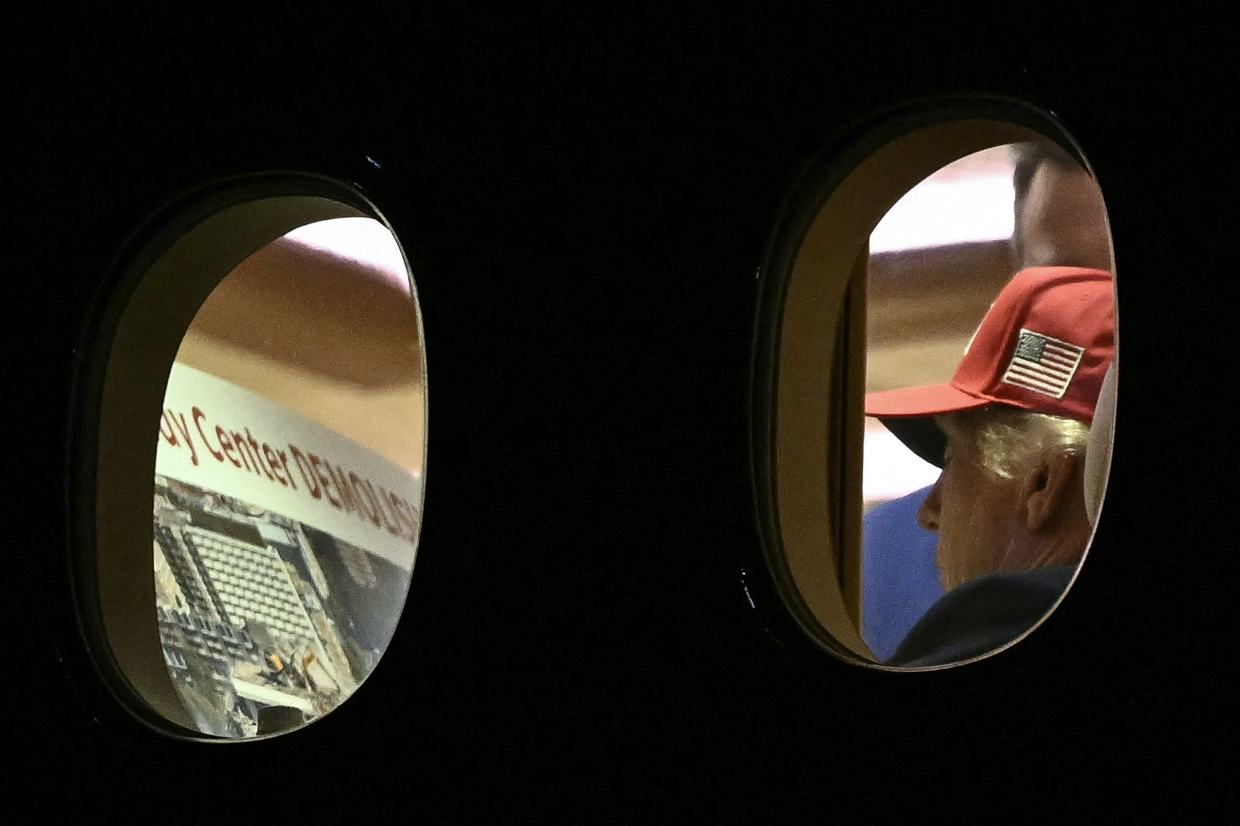 Donald Trump is seen aboard Air Force One checking a Kennedy Center large printout after landing at Joint Base Andrews.