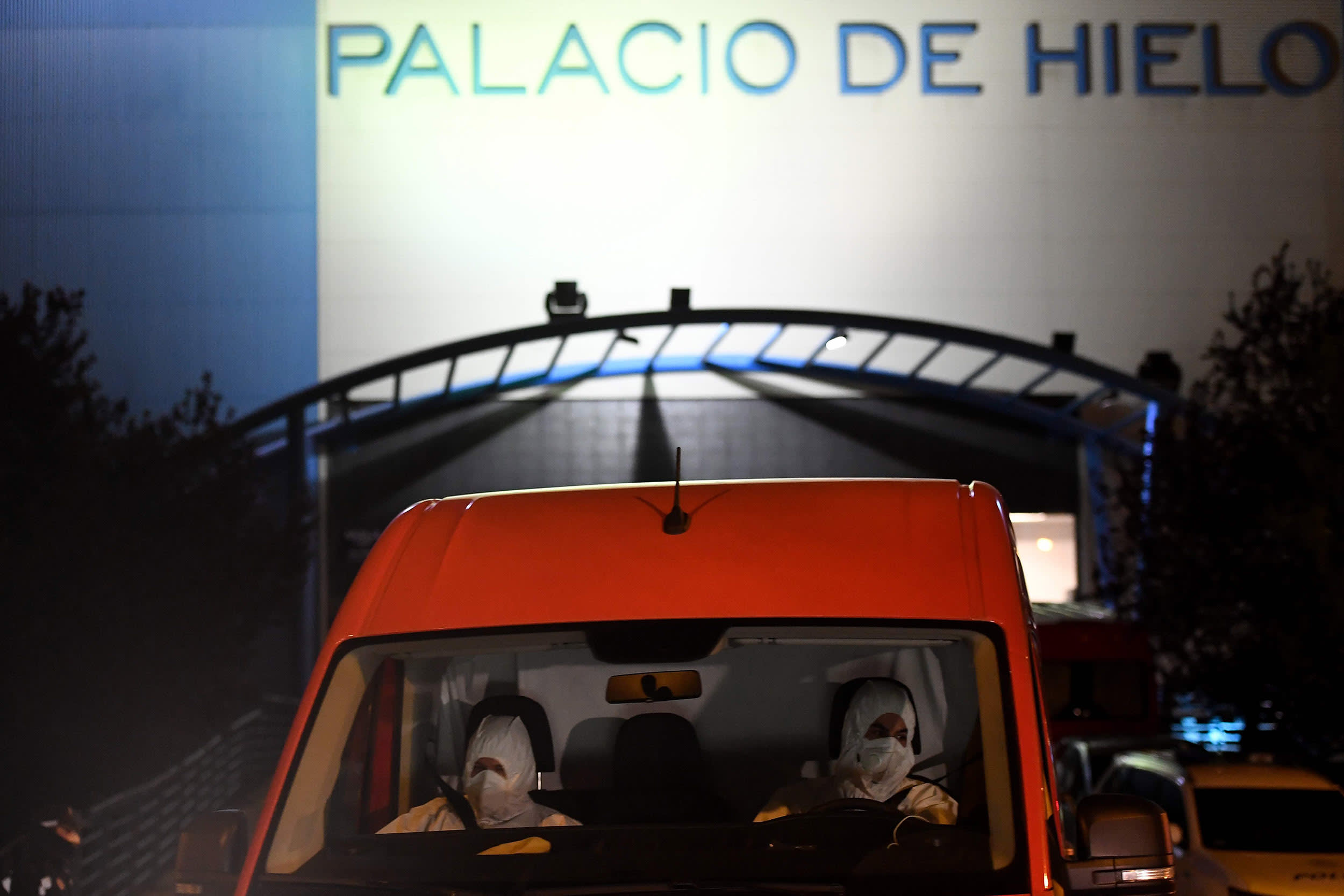 Image: Members of the Spanish Army's Military Emergency Unit outside Madrid's Palacio de Hielo shopping mall on Monday where an ice rink is being turned into a temporary morgue to help deal with the city's surge in coronavirus-related deaths.