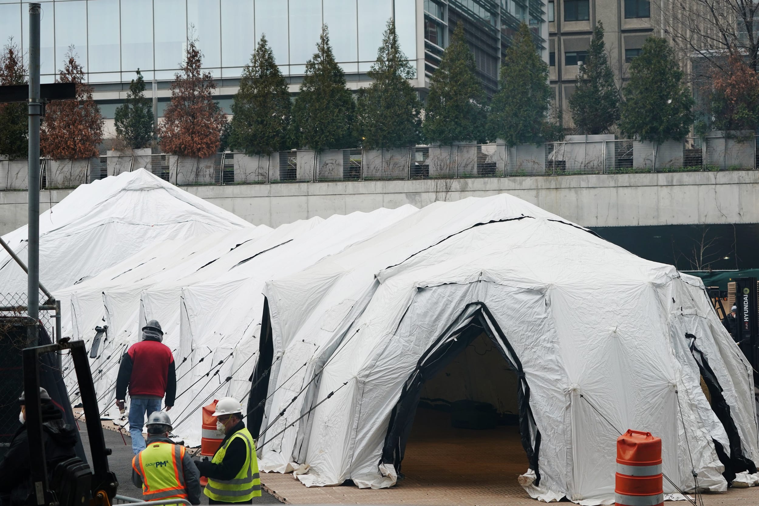 Workers build a makeshift morgue Wednesday outside of Bellevue Hospital in New York City to handle an expected surge in coronavirus victims.