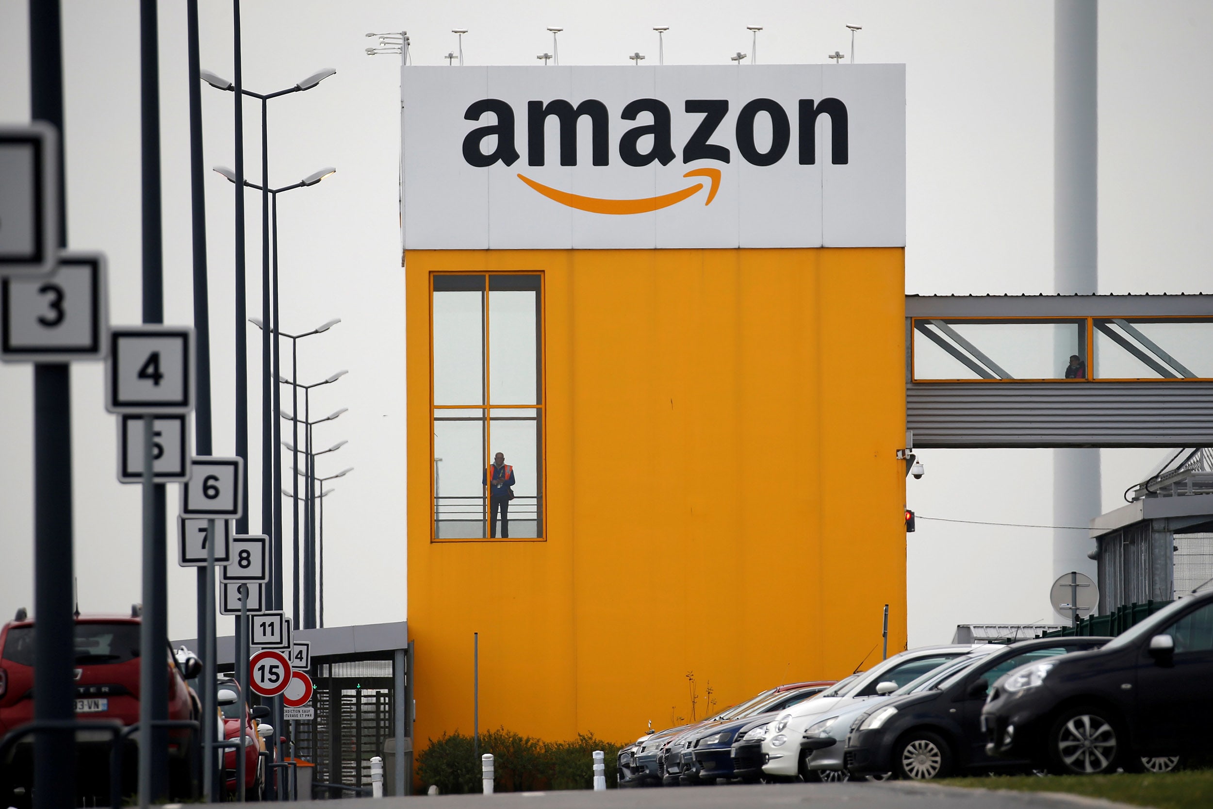 Image: The Amazon logo at the company logistics center in Lauwin-Planque, northern France