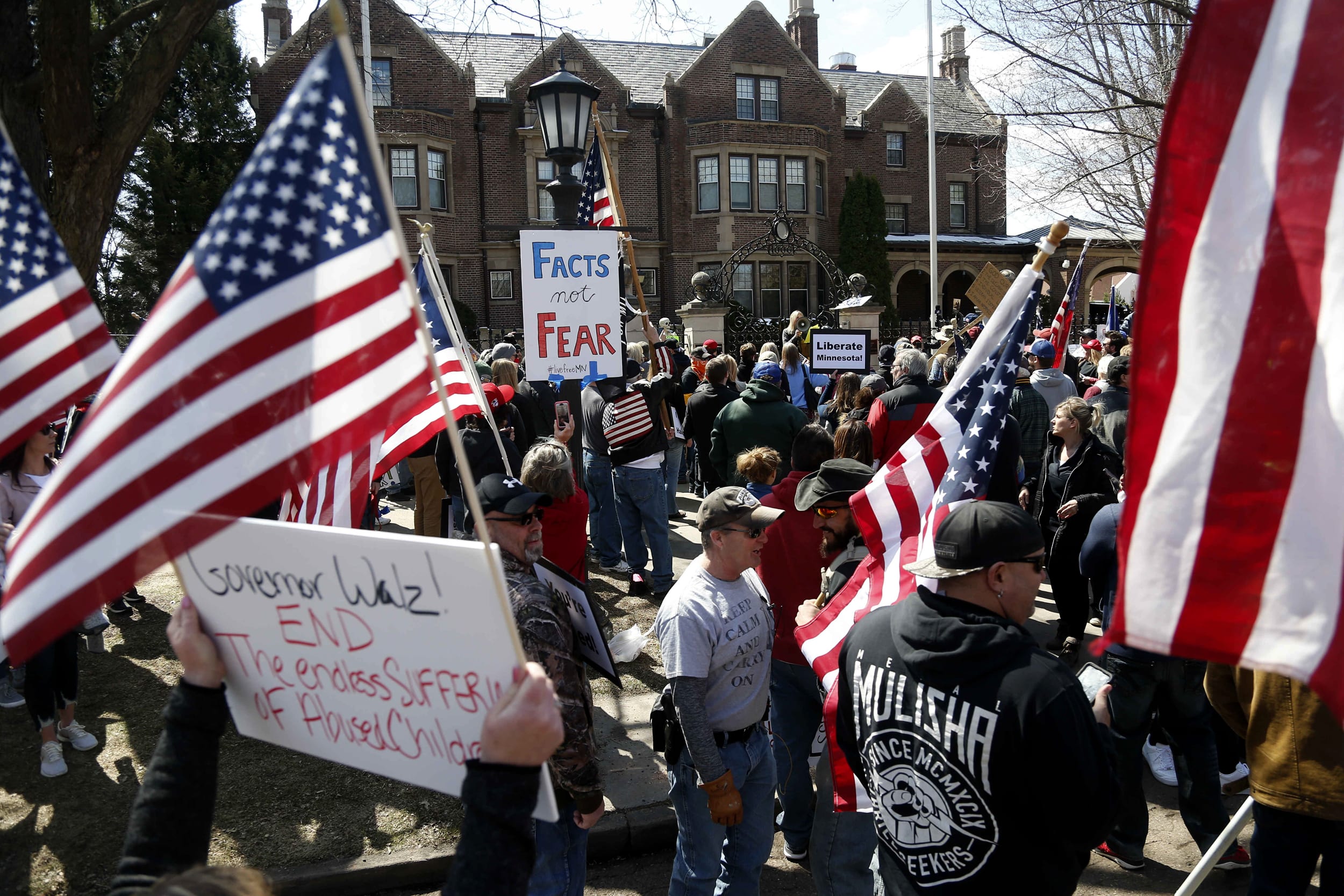 Image: Demonstrators call on Minnesota Governor Tim Walz to loosen stay-at-home restrictions, issued to slow the spread of coronavirus, outside of his residence in St. Paul on April 17, 2020.