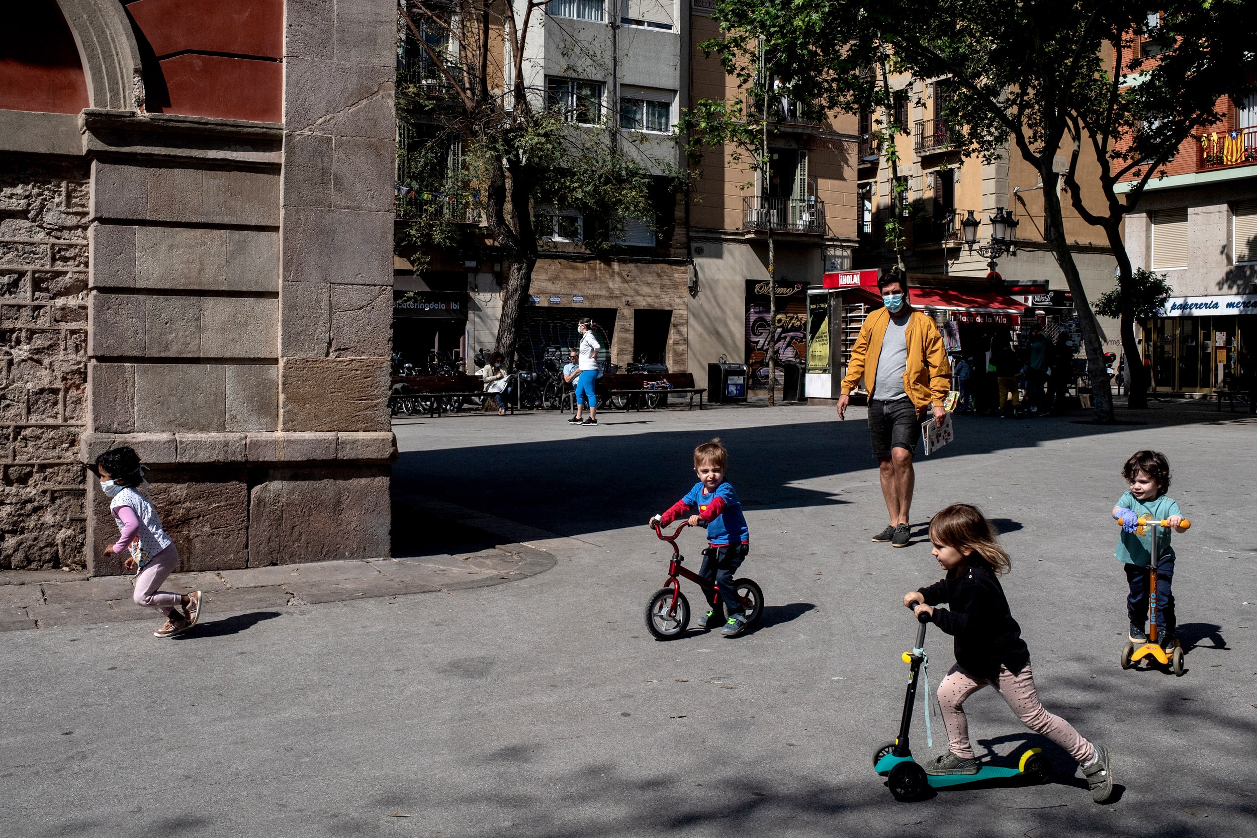 Image: Children play on the streets of Barcelona on April 26, 2020. Spain eased some lockdown restrictions, now allowing children to leave their homes for up to an hour per day.