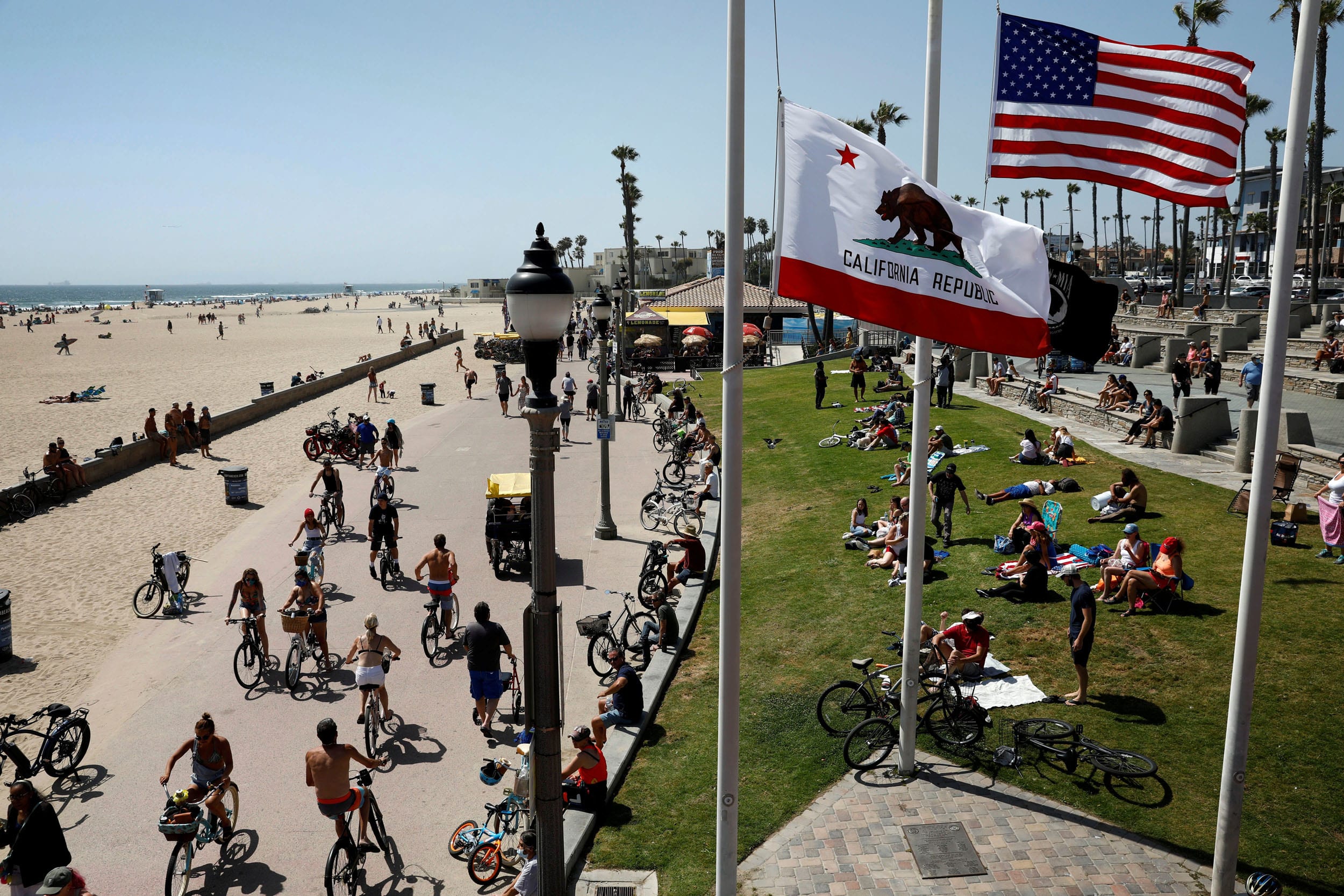 Image: People visit California's Huntington Beach on Memorial Day weekend on May 23, 2020.