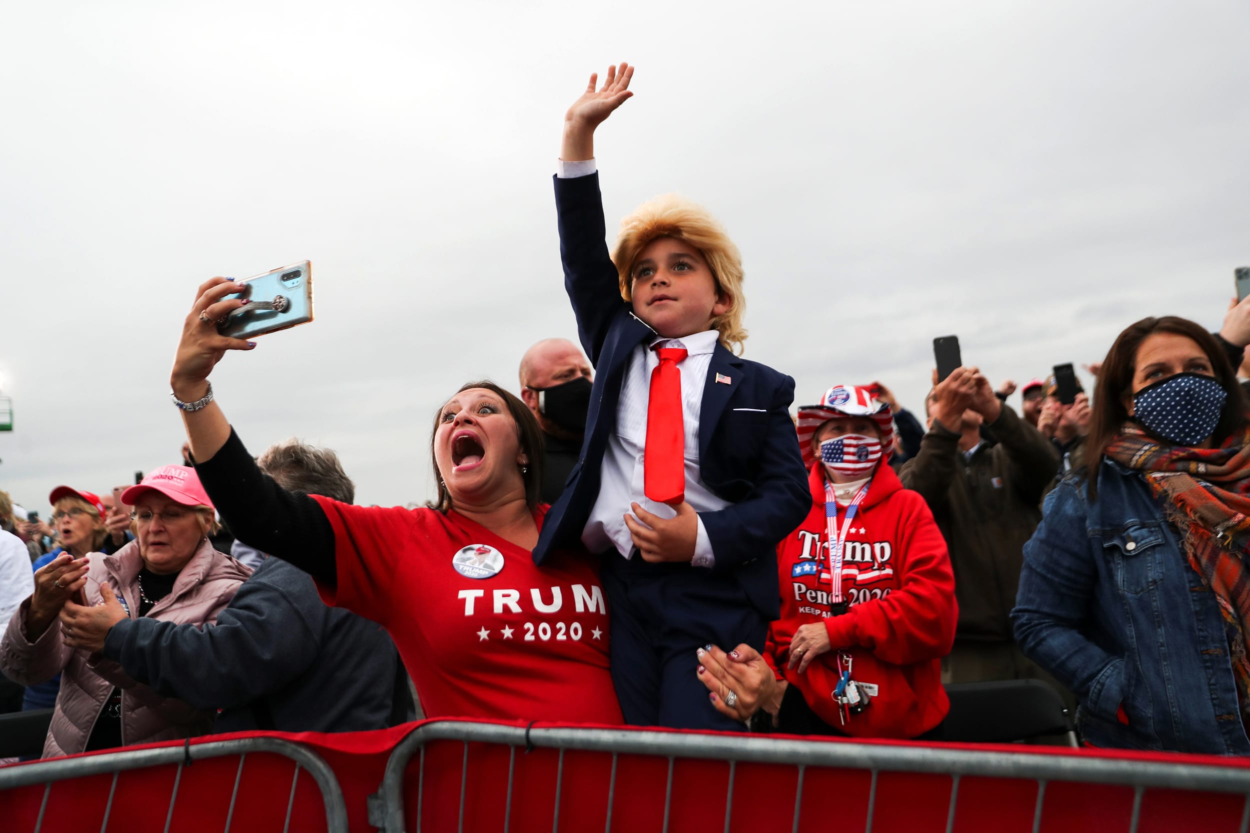 Image: A child dressed as President Donald Trump waves during the president's campaign event in Martinsburg, Pa., on Oct. 26, 2020.