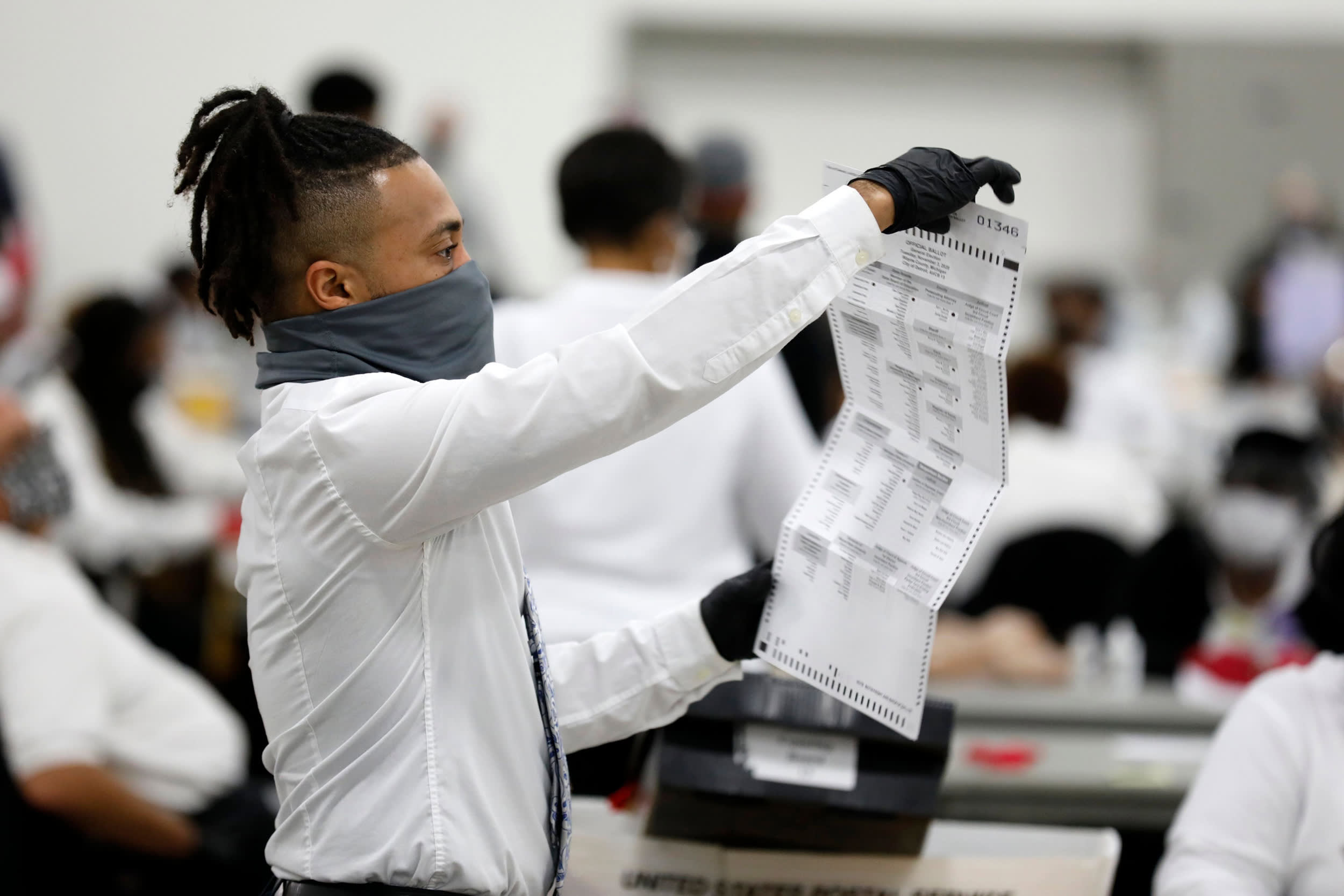 Election workers count absentee ballots at TCF Center on Nov. 4, 2020 in Detroit.