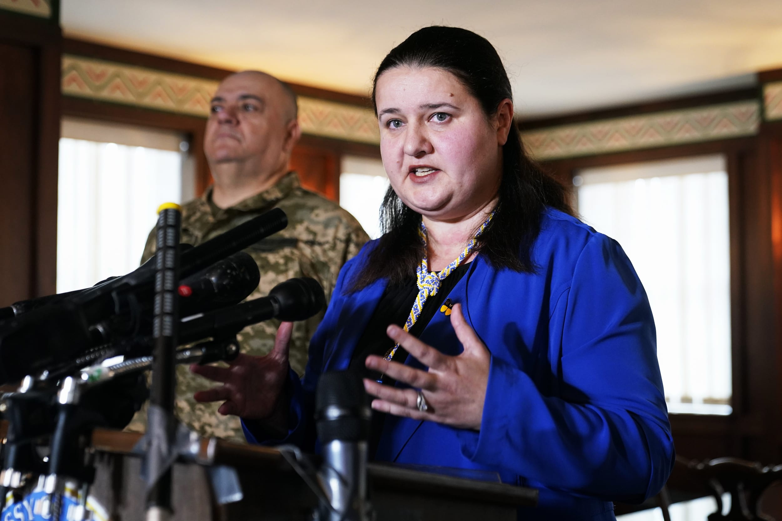 Ukraine's Ambassador to the United States Oksana Markarova speaks at the Ukrainian embassy in Washington on Feb. 24, 2022. Standing at left with Markarova is Maj. Gen. Borys Kremenetskyi, Defense Attache with the Embassy of Ukraine.