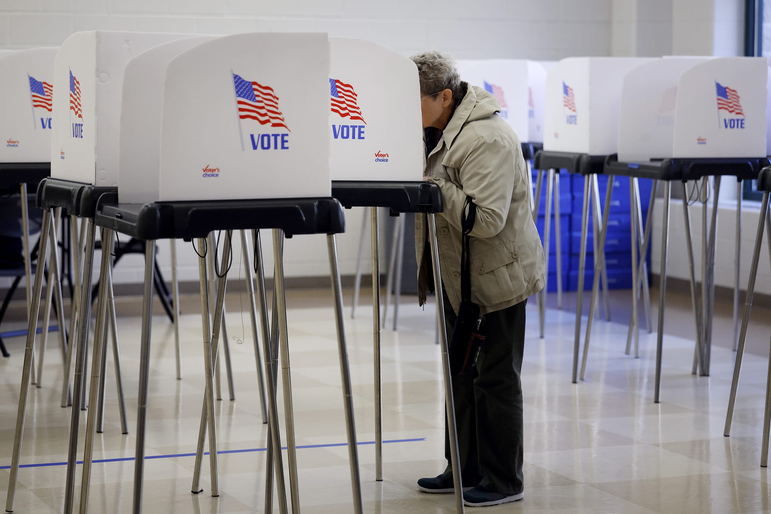 Image: A voter fills out their ballot in Silver Spring, Md., on Oct. 27, 2022.