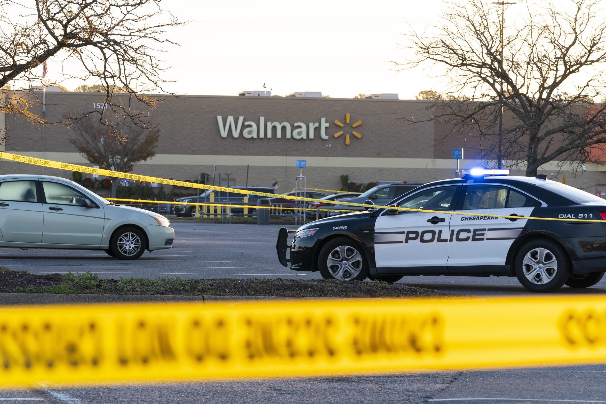 Law enforcement work the scene of a mass shooting at a Walmart, in Chesapeake, Va., on Nov. 23, 2022. 