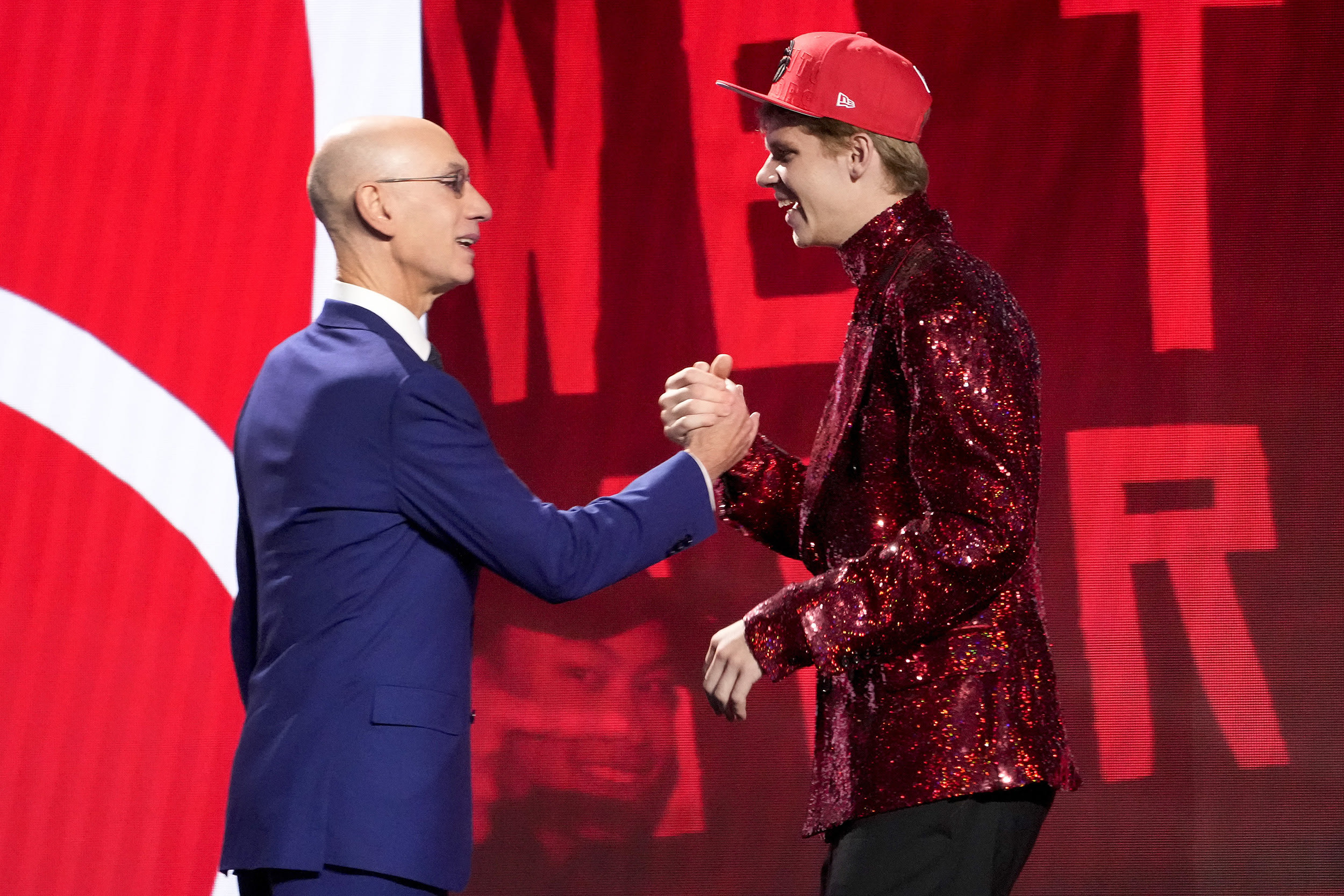Gradey Dick greets NBA Commissioner Adam Silver after being selected 13th overall by the Toronto Raptors during the NBA basketball draft, Thursday, June 22, 2023, in New York.