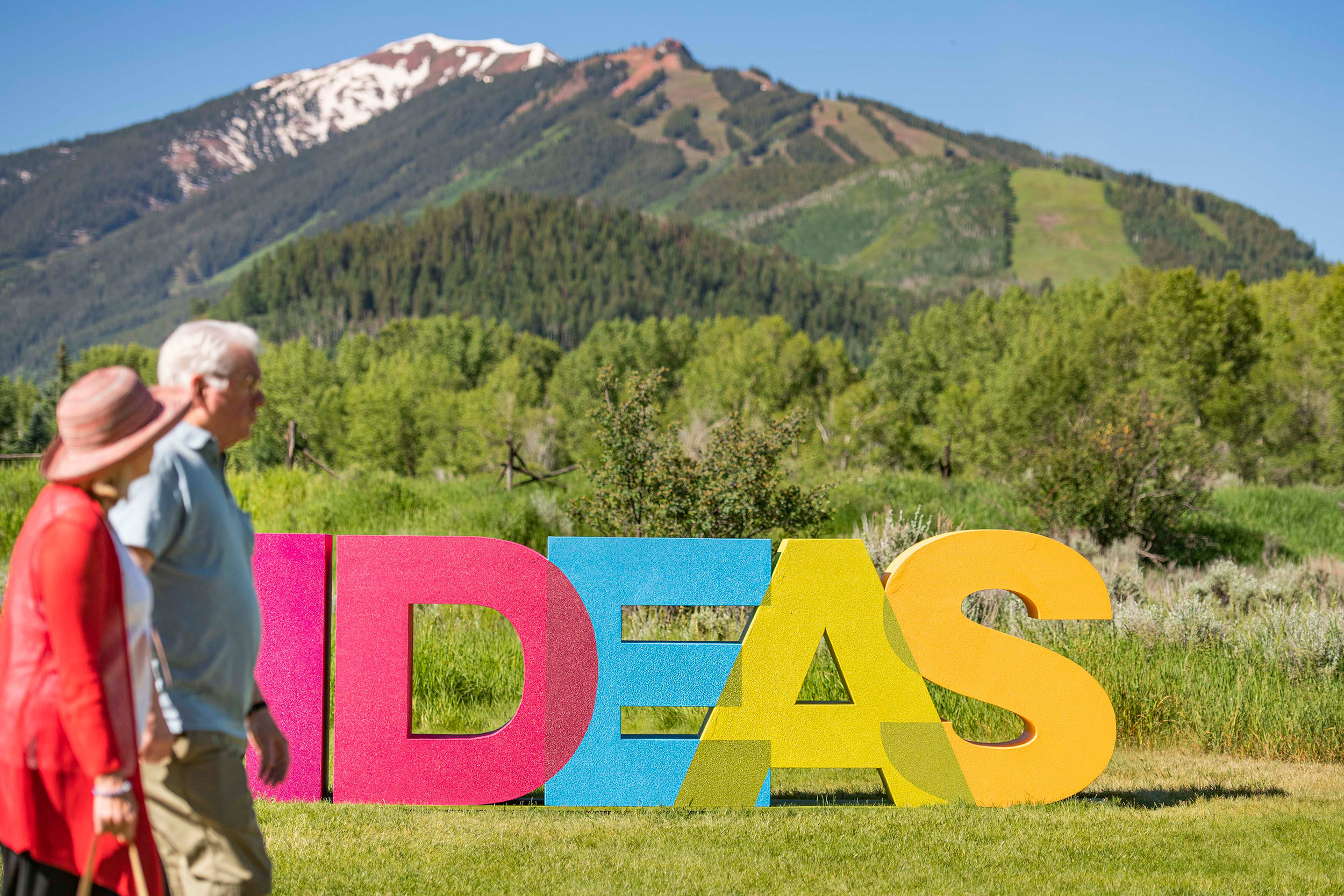 Attendees stroll through the Aspen Institute property during the Aspen Ideas Festival in Colorado on Monday, June 26, 2023.