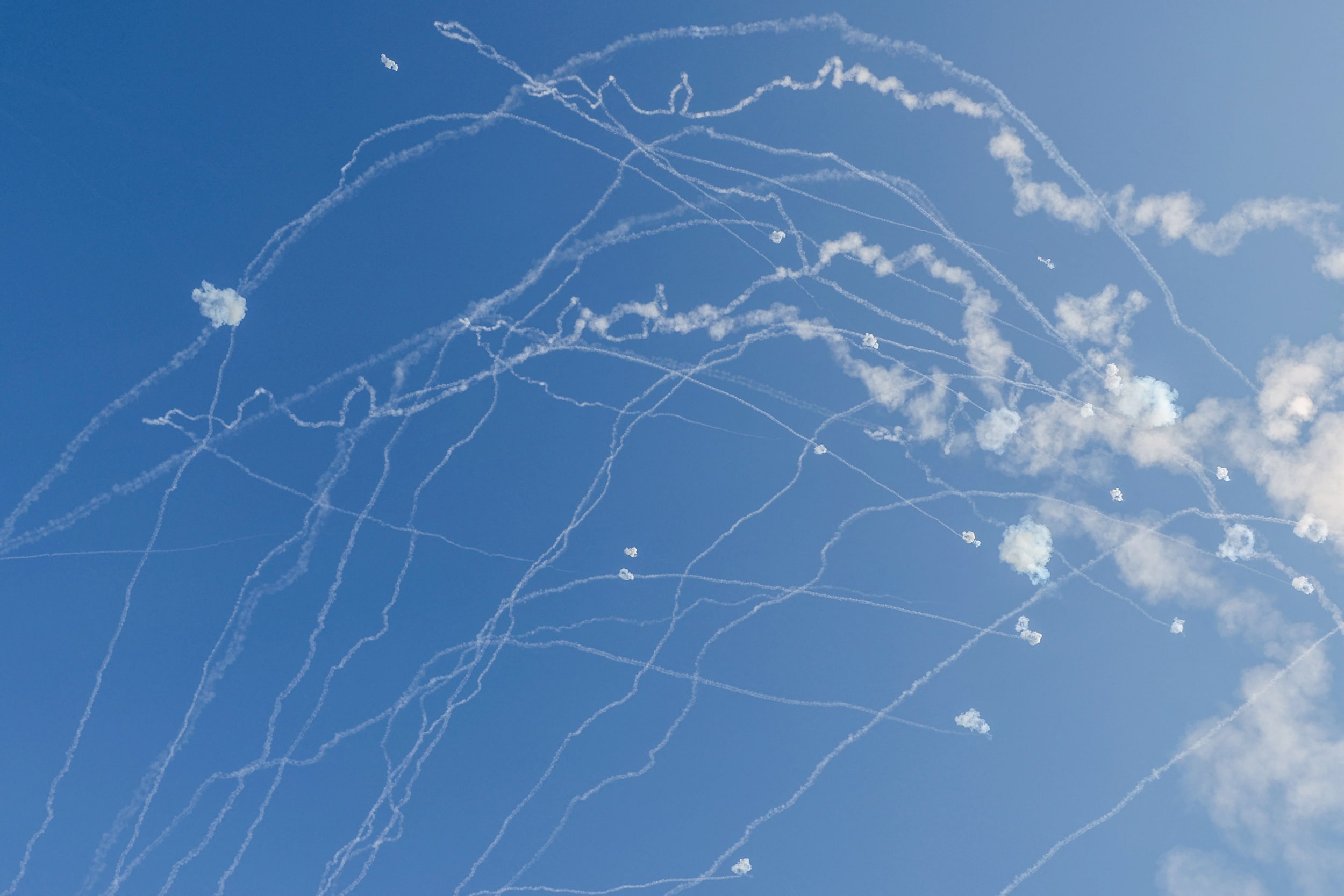 Rockets fired from the Gaza Strip are intercepted by Israel's Iron Dome defense missile system over Ashkelon on Oct. 10, 2023.