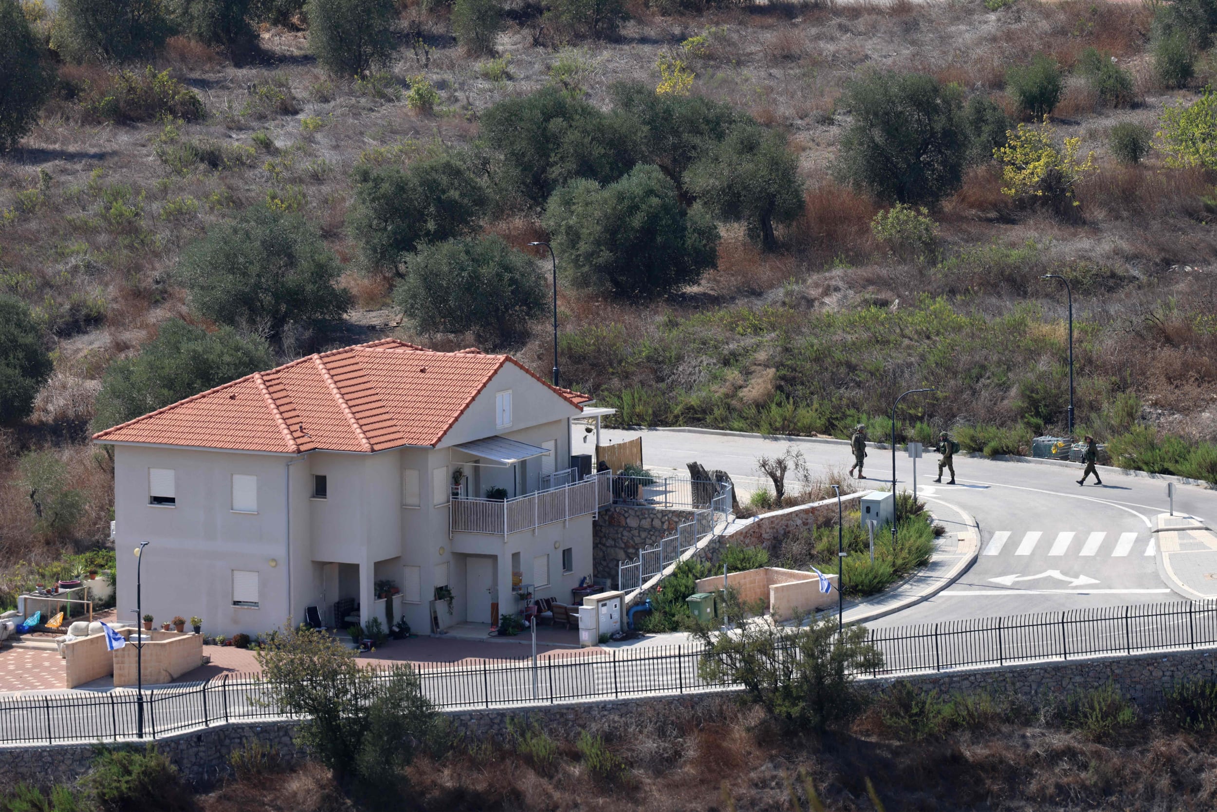 Israeli soldiers patrol the Israeli village of Metula near the border with Lebanon on October 13, 2023. 