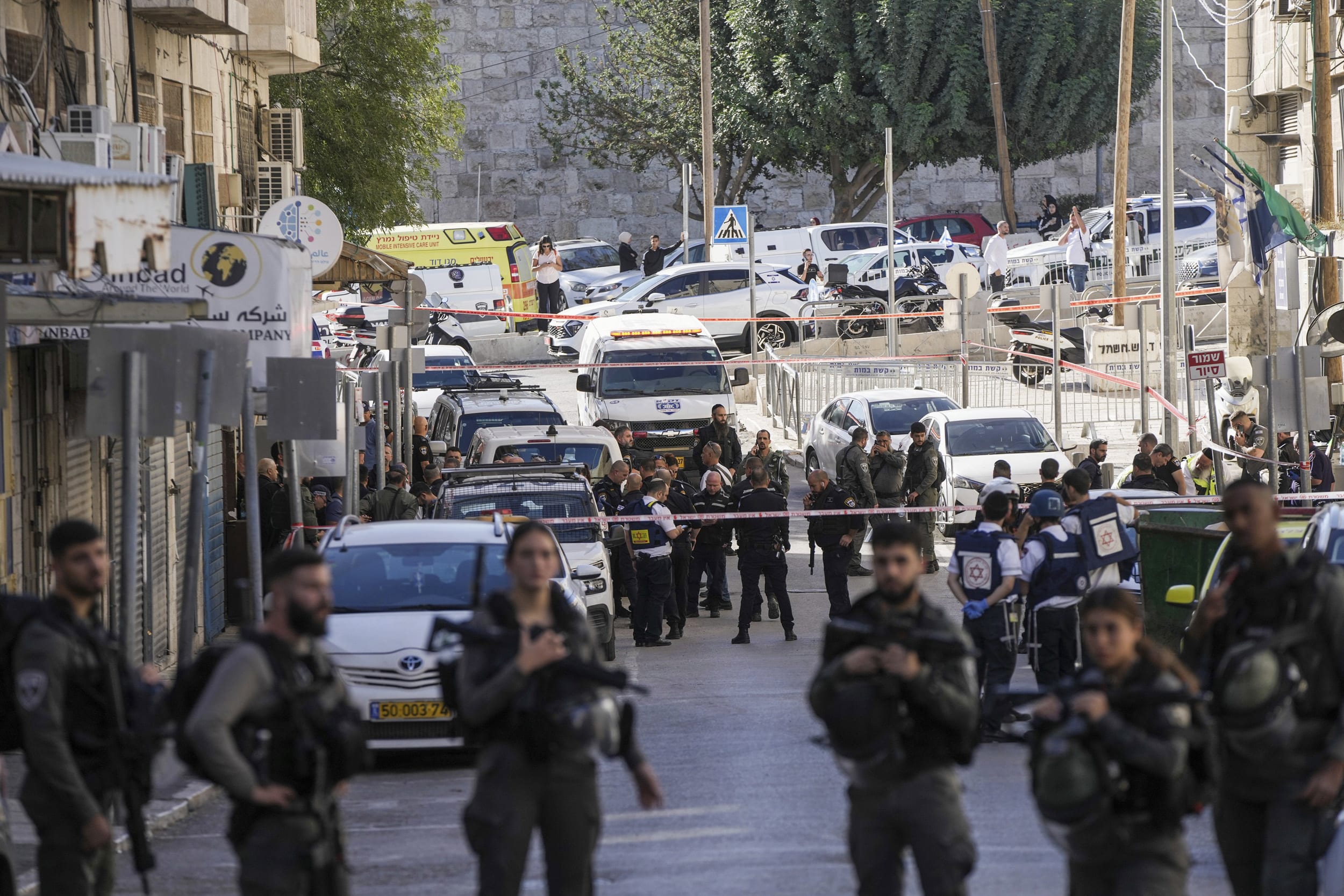 Two Israeli border police officers were stabbed near a police station in east Jerusalem, critically wounding one of them.