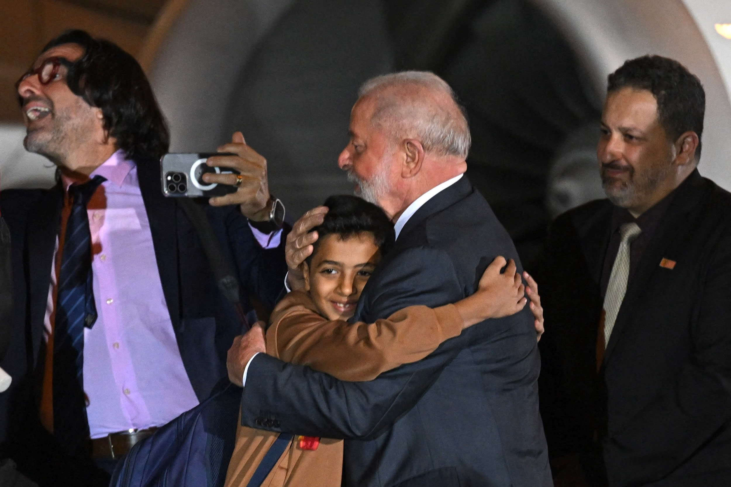 Brazilian President Lula da Silva welcomes Brazilians and Palestinians returning from the Gaza Strip at Brasilia Air Base on Nov. 13, 2023.