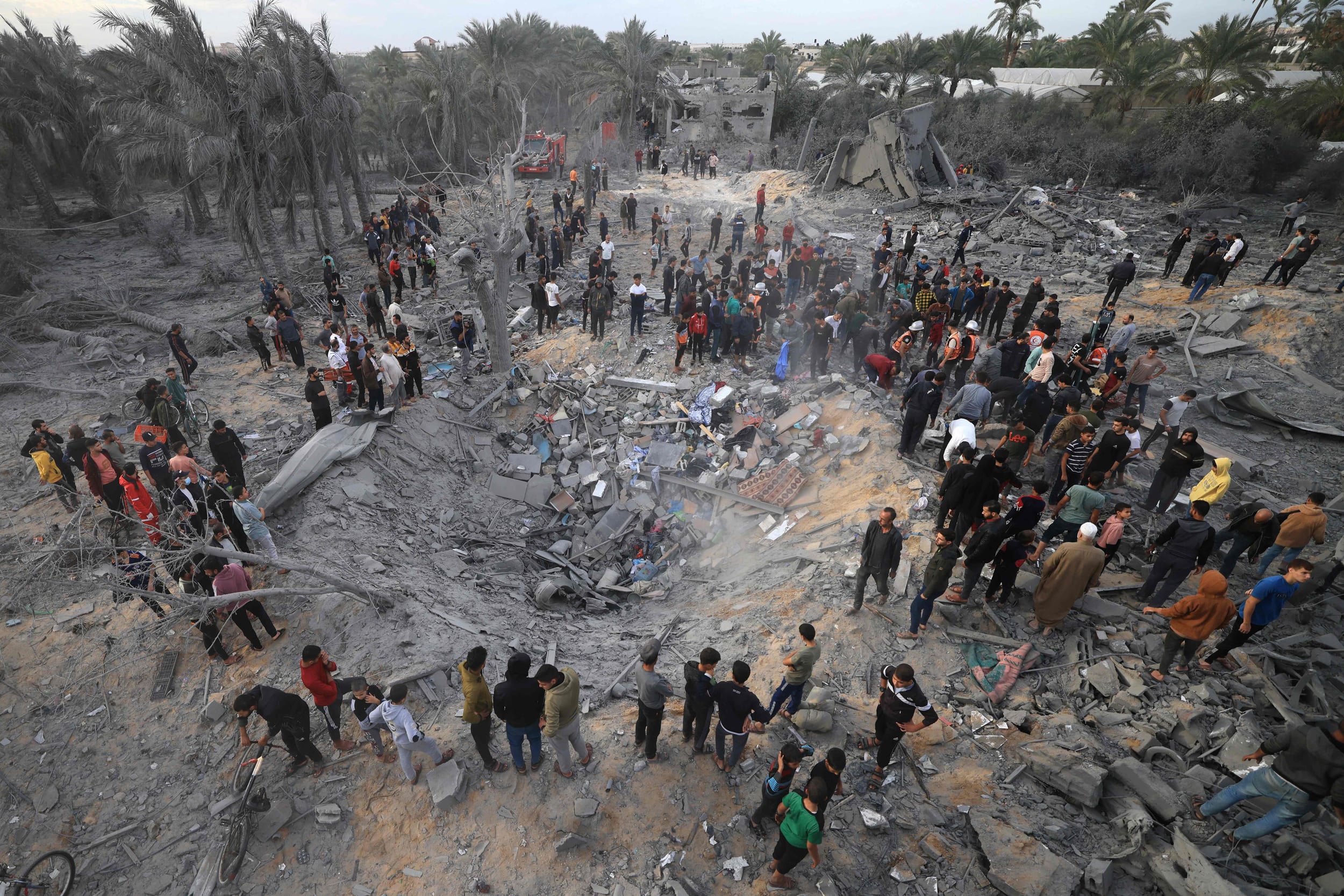 Palestinians inspect the damage after an Israeli strike on a house in Khan Younis, in the southern Gaza Strip, on Nov. 22, 2023.