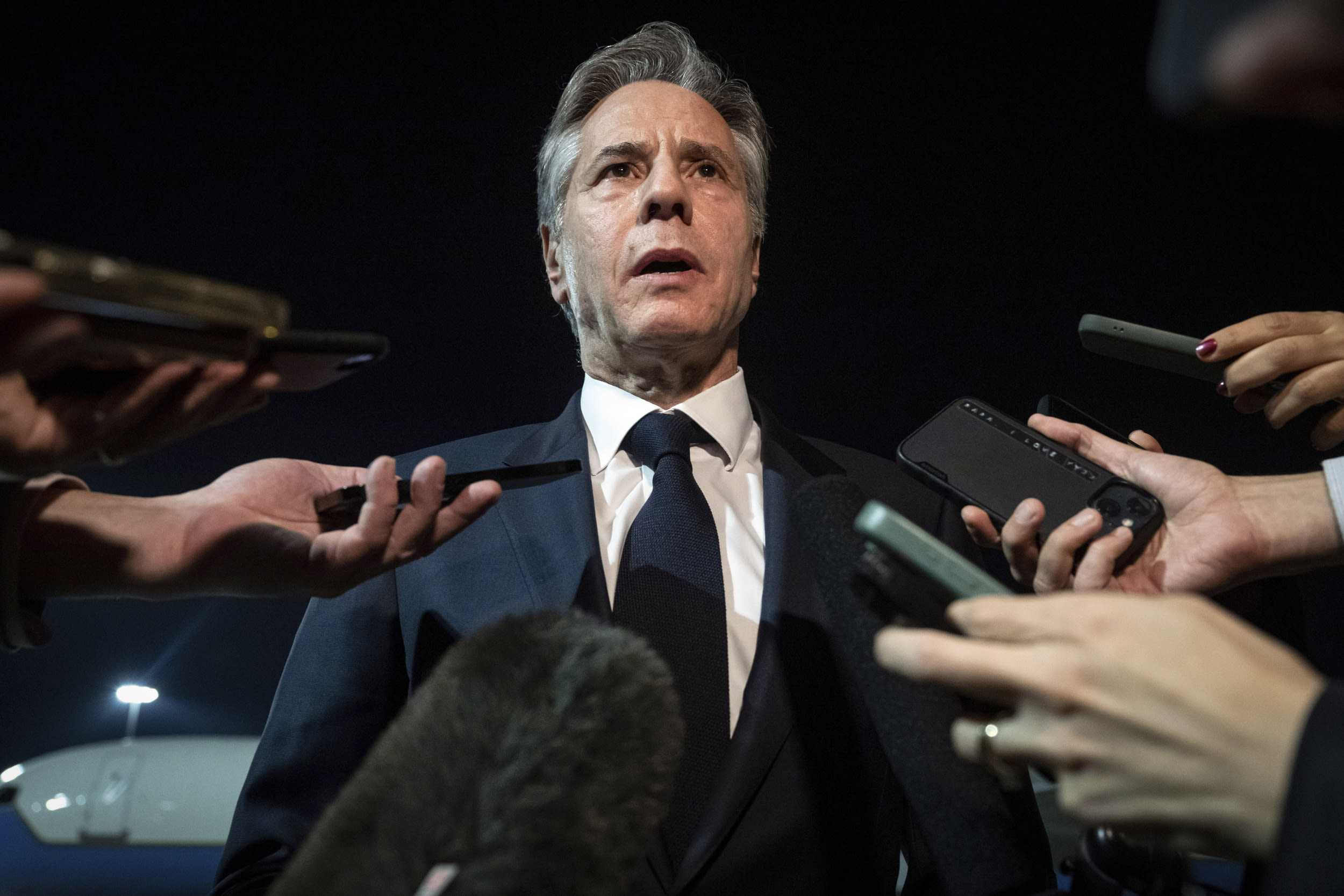 Secretary of State Antony Blinken speaks to the media as he departs at the airport in Dubai.