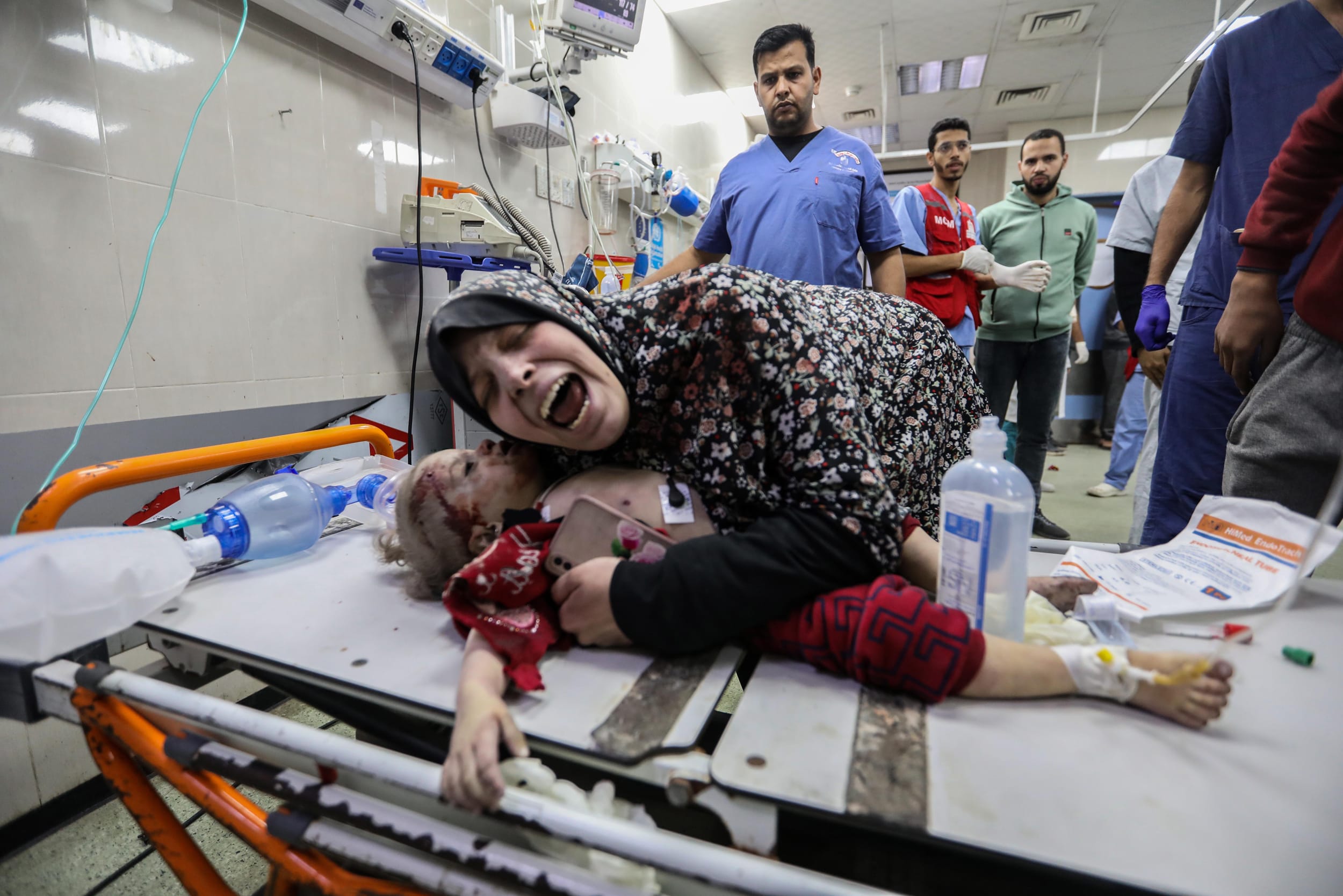 A mother hugs fifteen-month-old Nisreen Jundiyeh after she died from her injuries at a hospital in Khan Yunis on Dec. 20, 2023.