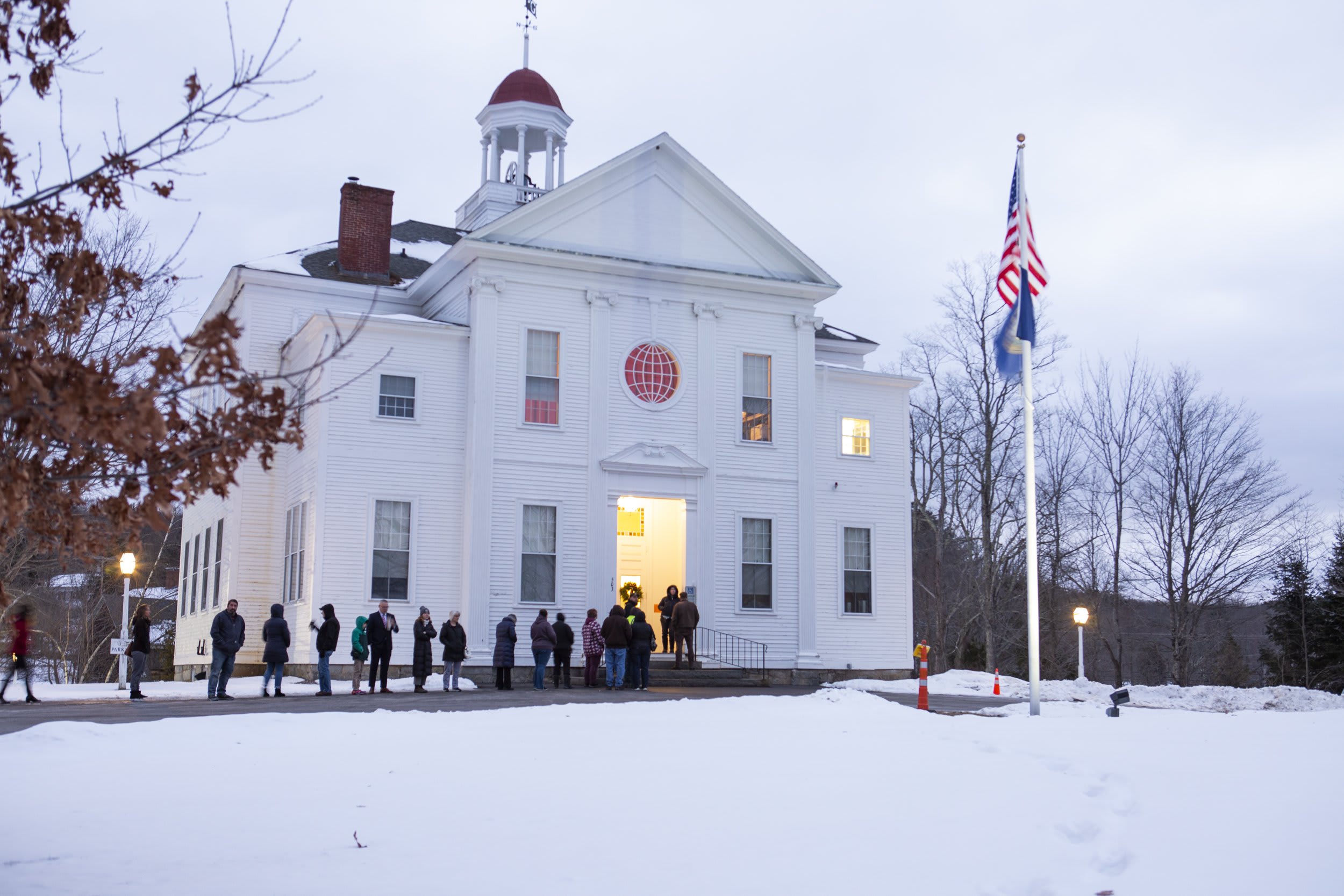 New Hampshire primary voters wait for the doors to open at 7 a.m. at the Academy in Gilmanton on Jan. 23, 2024.