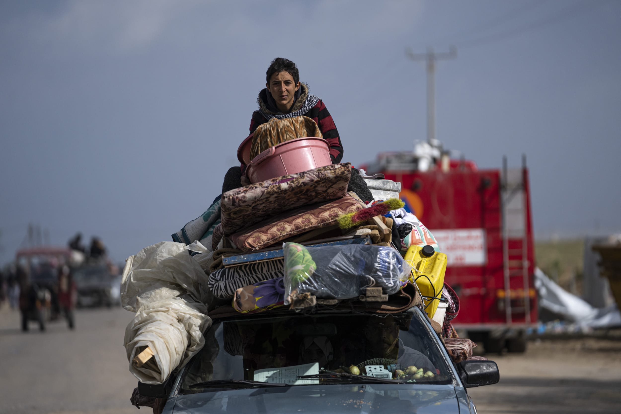 Palestinians arrive in the southern Gaza town of Rafah after fleeing an Israeli ground and air offensive in the nearby city of Khan Younis on Wednesday, Jan. 24, 2024. 