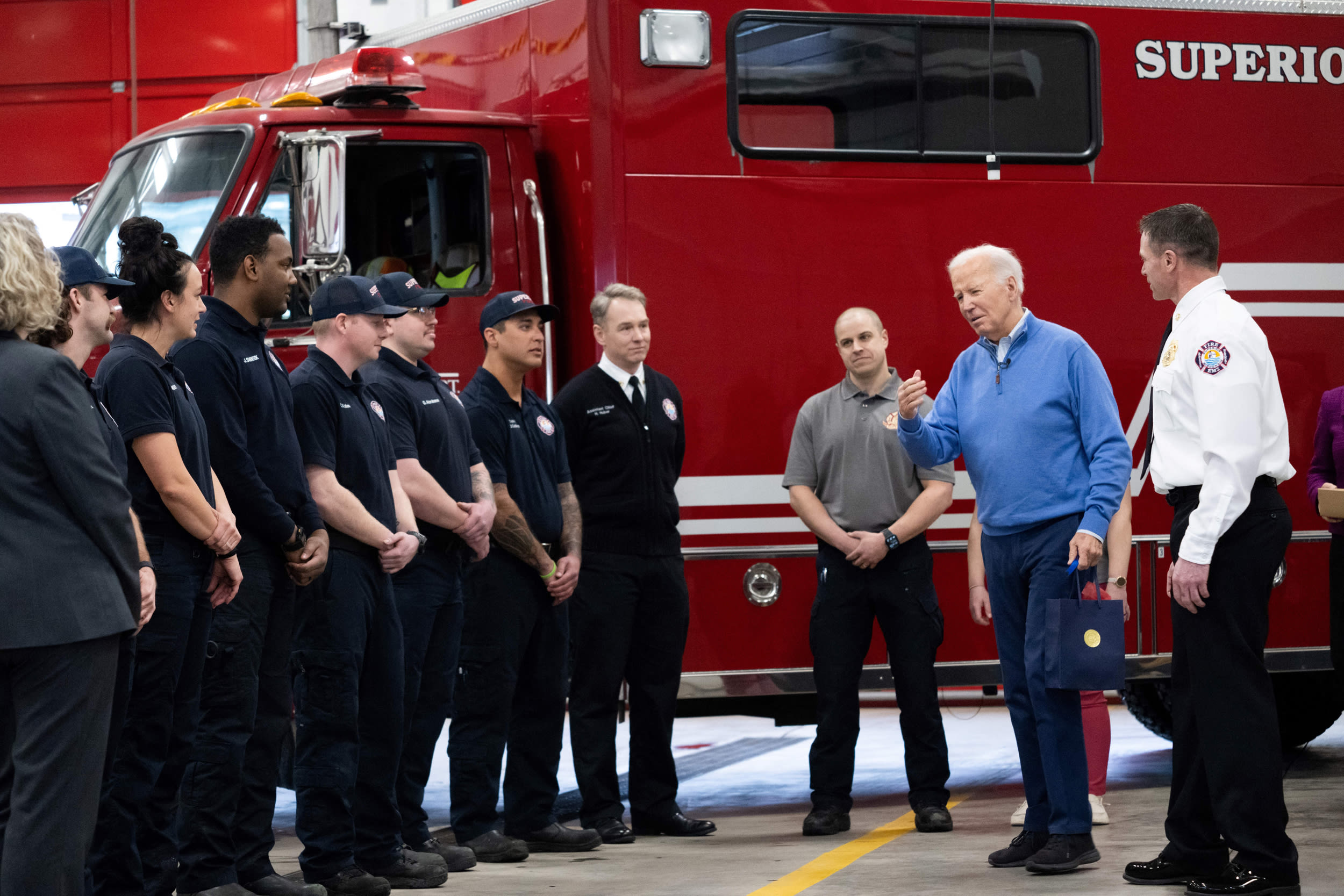 President Joe Biden visits with firefighters at the Superior Fire Department in Superior, Wis., on Jan. 25, 2024.