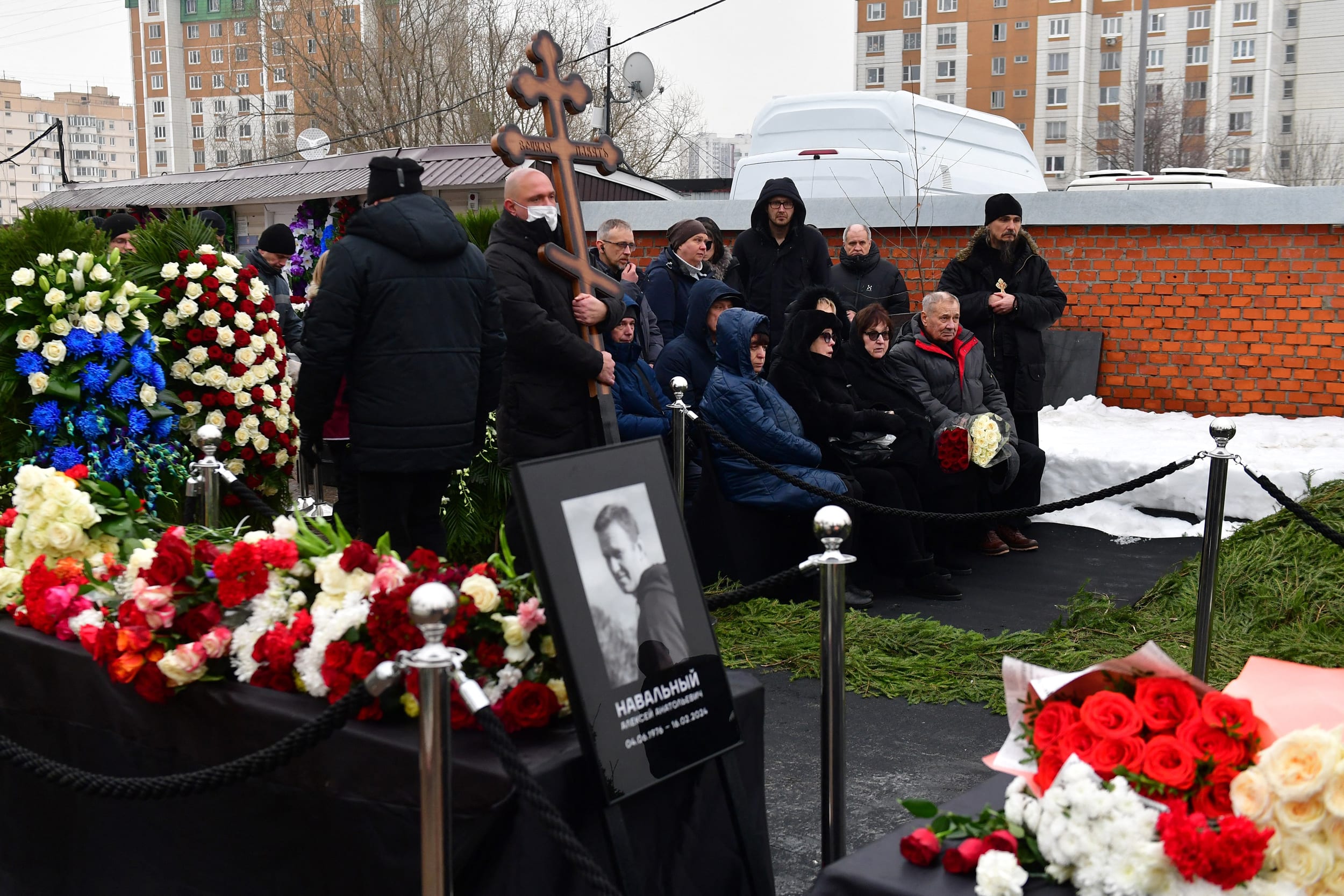 Lyudmila Navalnaya, third right, and Anatoly Navalny, second right, parents of late Russian opposition leader Alexei Navalny, attend the funeral ceremony for their son at the Borisovo cemetery in Moscow