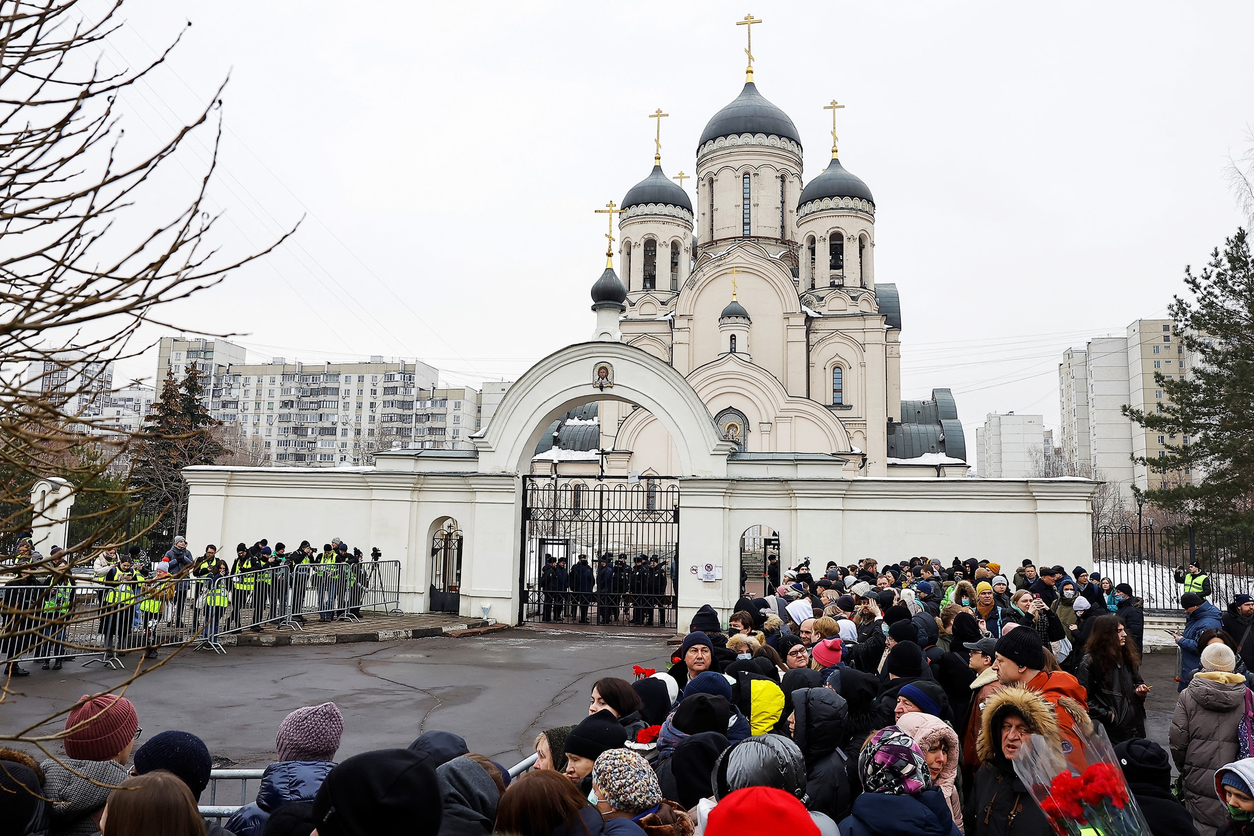People gather outside the Soothe My Sorrows church as they wait for a funeral service and a farewell ceremony for Russian opposition politician Alexei Navalny in Moscow, Russia, March 1, 2024.