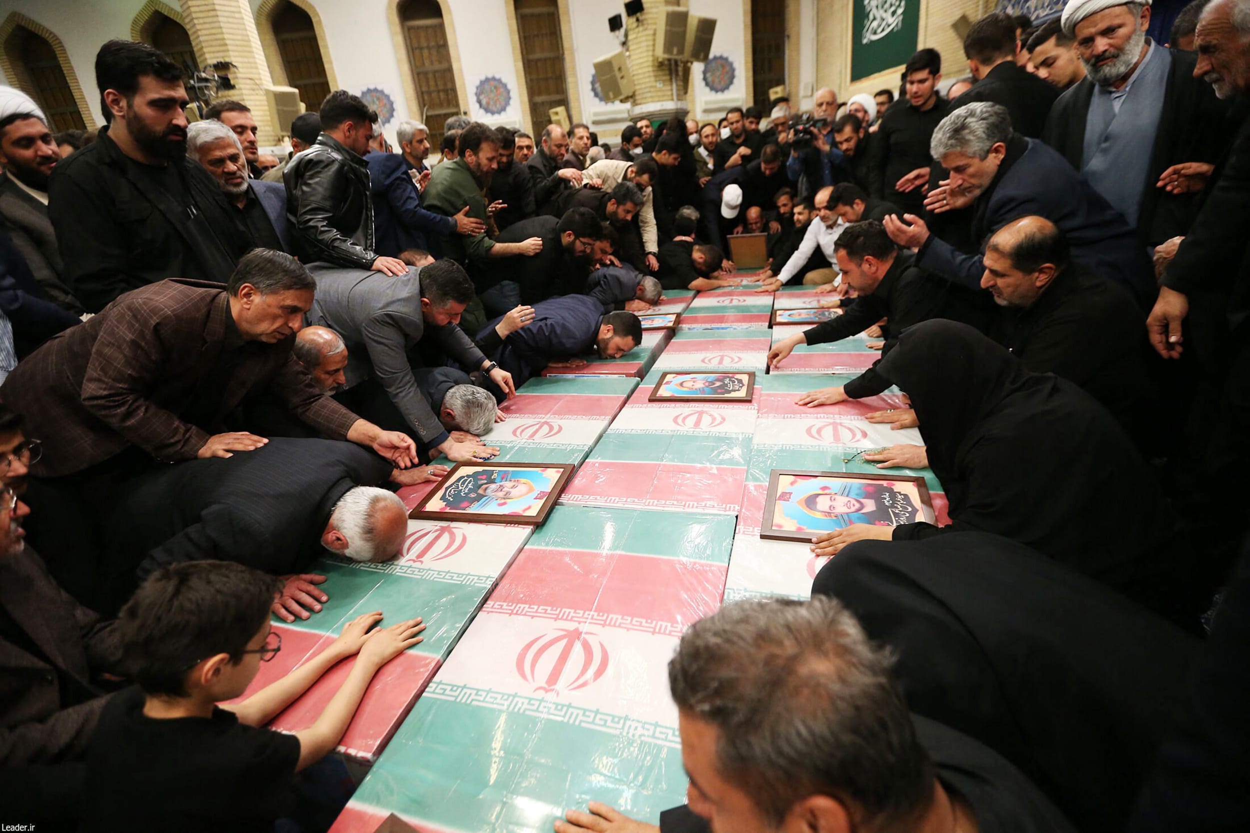 Iran's Supreme Leader Ayatollah Ali Khamenei prays over the coffins of seven Revolutionary Guard Corps members on April 4, 2024, after they were killed in a strike on the country's consular annex in Damascus, Syria.