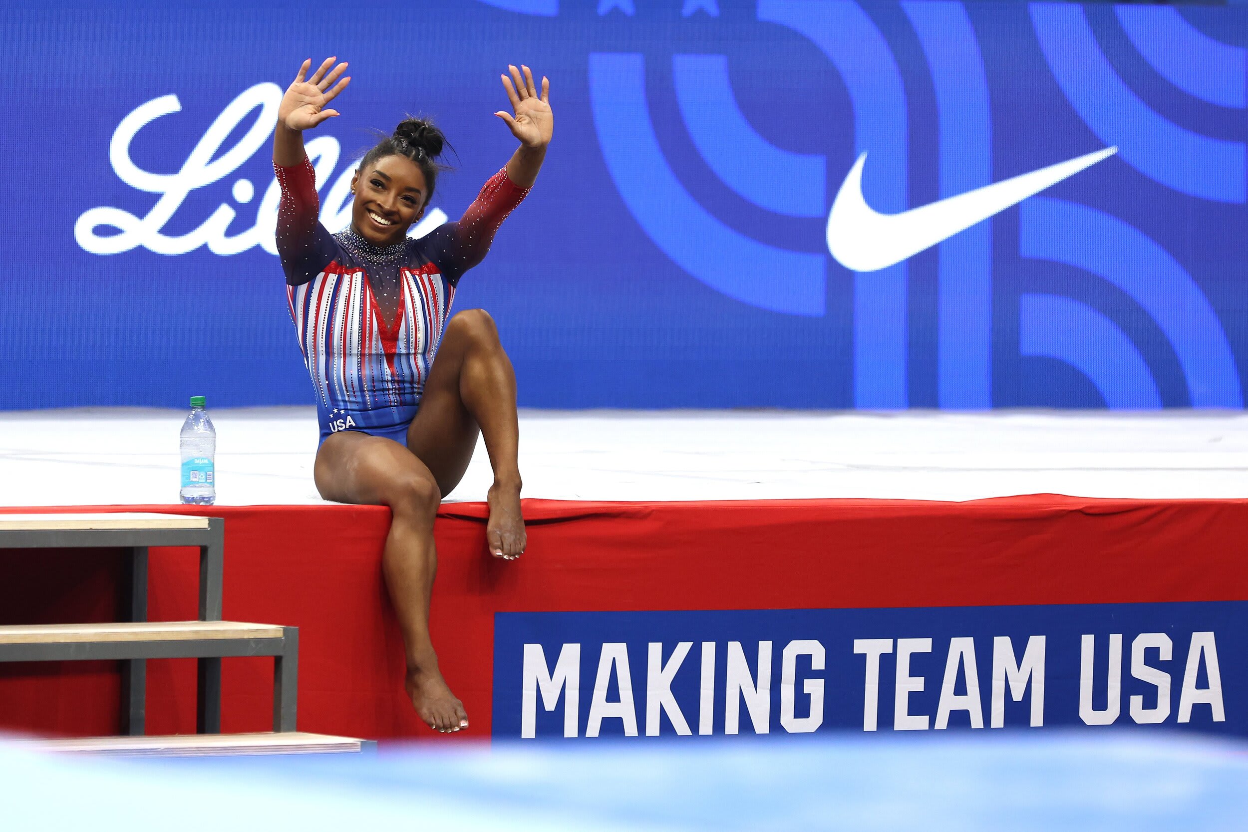 Simone Biles waves to fans on the final night of the 2024 U.S. Olympic Team Gymnastics Trials.