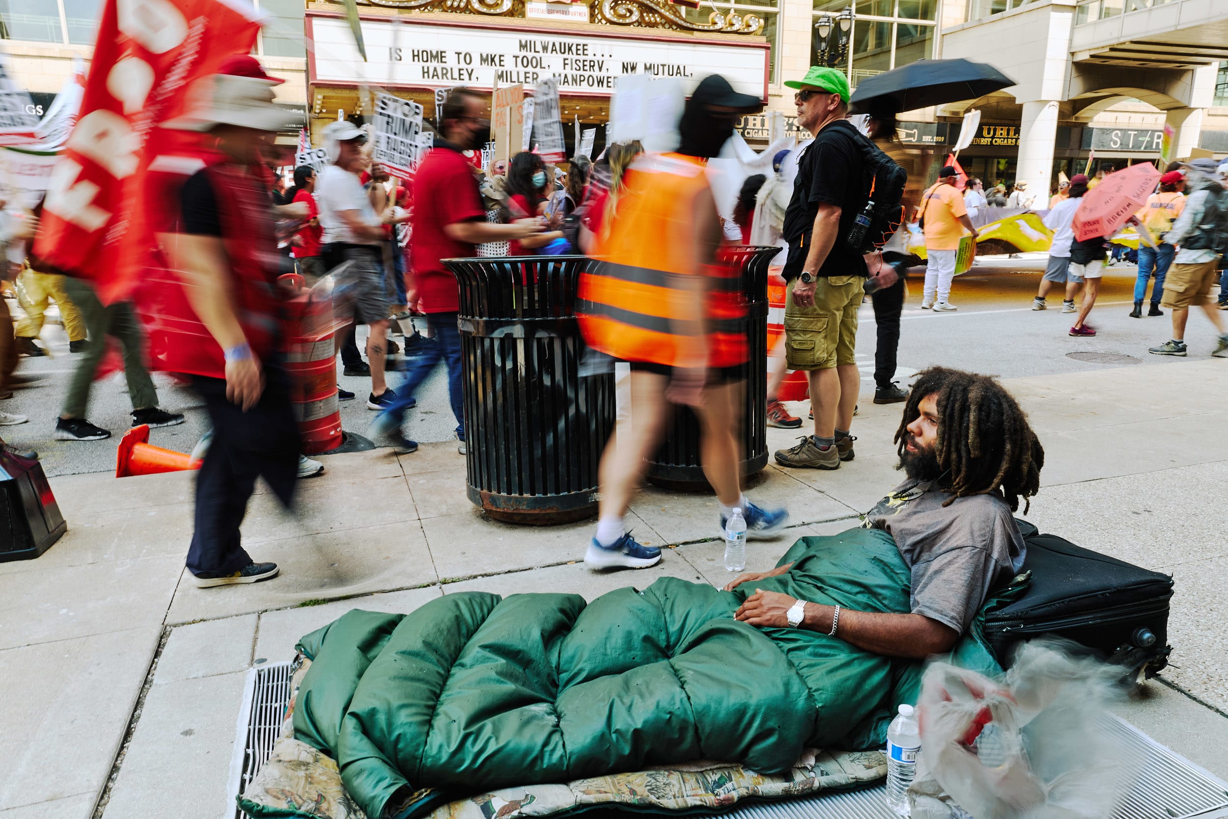 Memphis Thorton looks on from his sleeping bag as protestors march against the Republican National Convention in Milwaukee, W.I. on July 15, 2024. 
