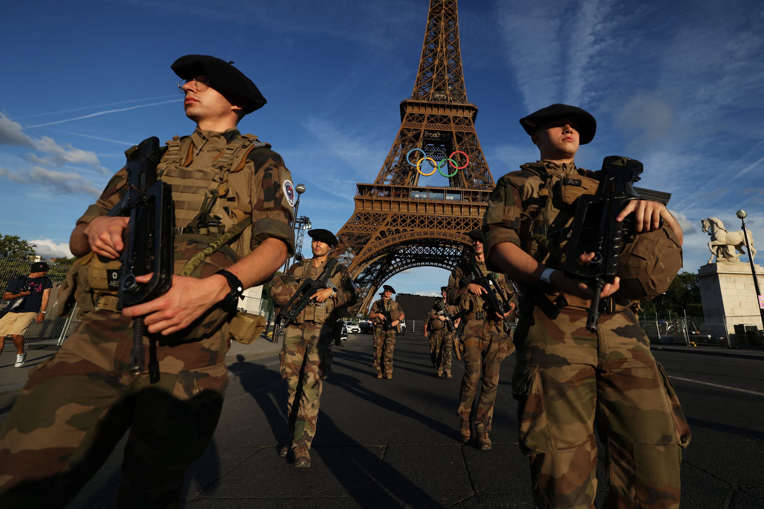 French soldiers patrol near to Eiffel Tower in Paris on July 21, 2024, ahead of the Paris 2024 Olympic and Paralympic Games.