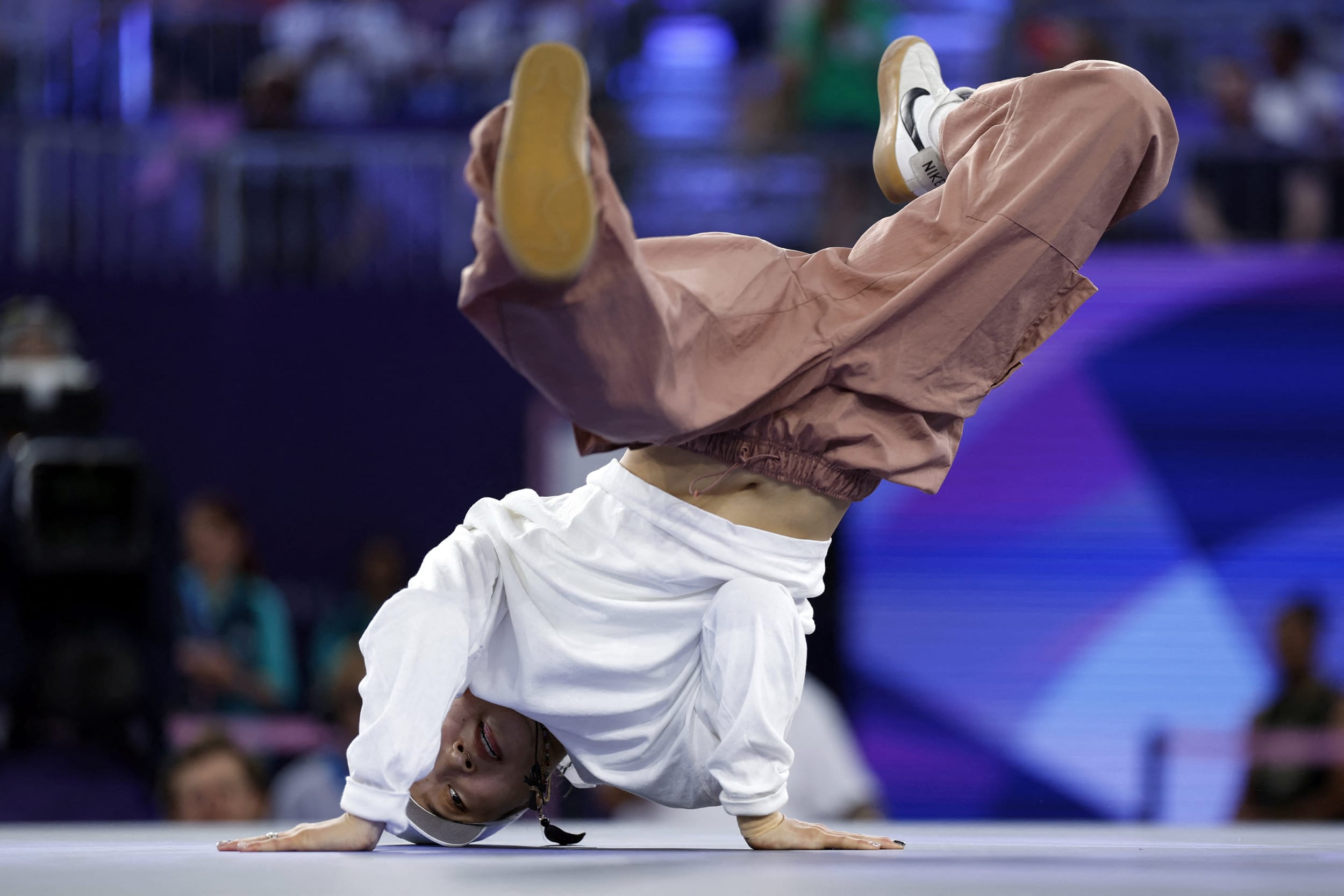 Japan's Ami competes in the women's breaking dance round robin