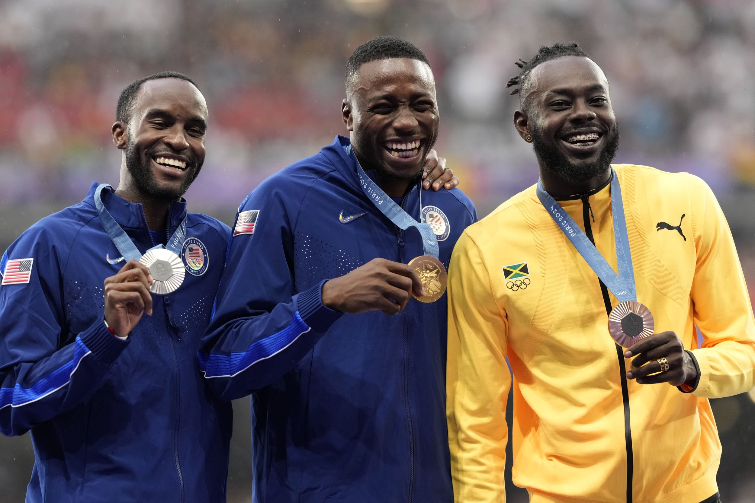 Men's 110-meter hurdles gold medalists Grant Holloway (gold), Daniel Roberts (silver) and Rasheed Broadbell (bronze) on the podium at the 2024 Summer Olympics.