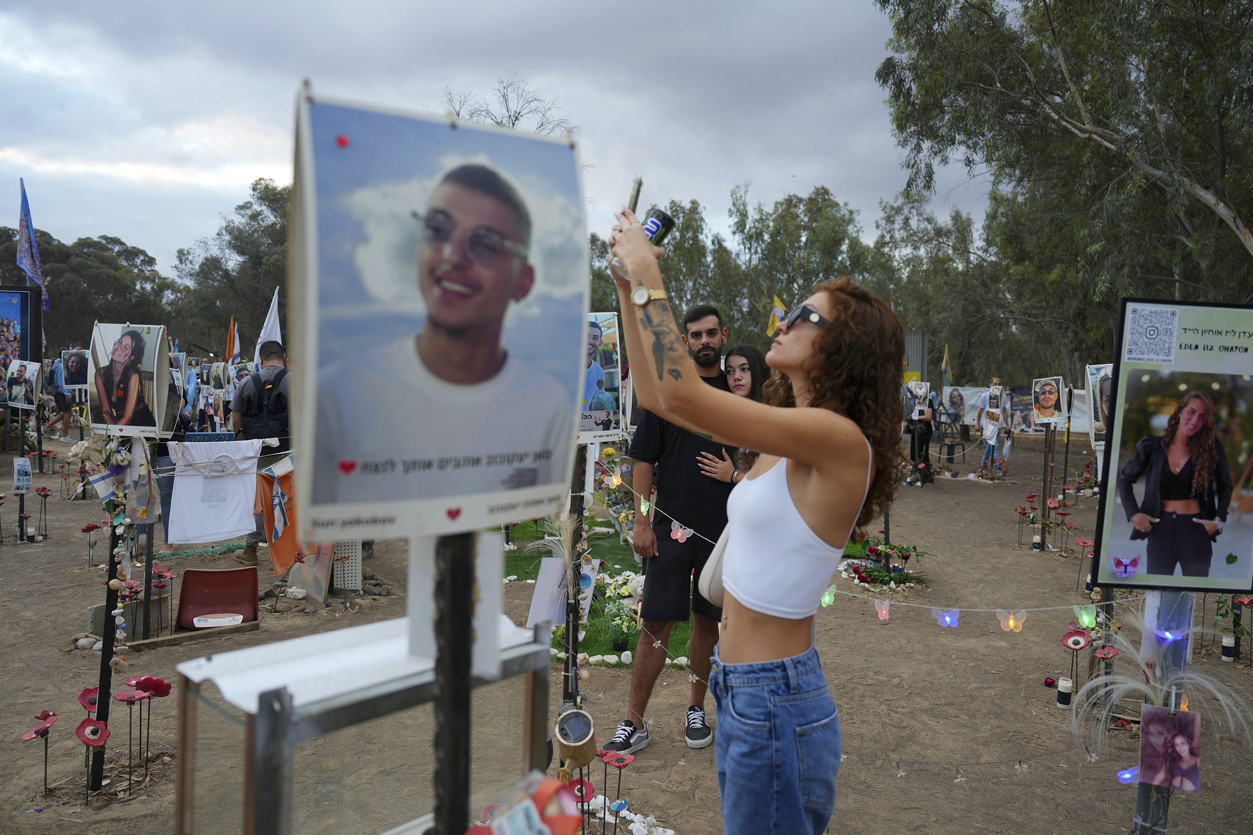 Mourners attend a vigil at the Nova Music Festival site in southern Israel on Oct. 7, 2024.