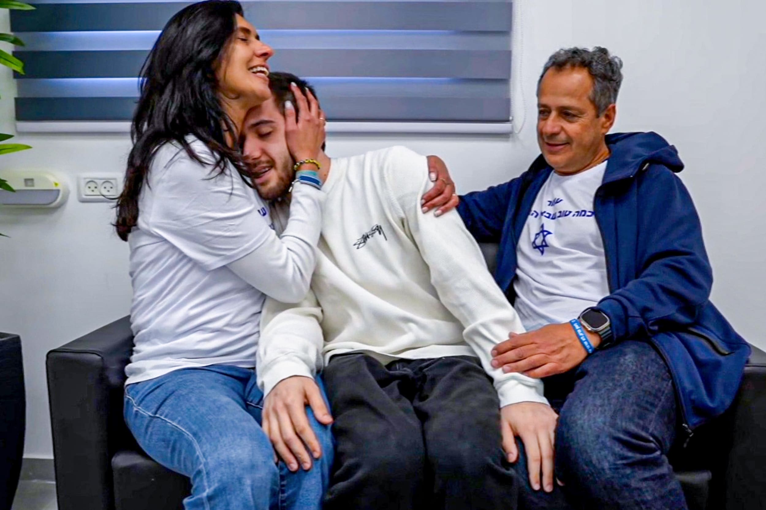 Omer Shem Tov at the moving meeting with his parents, Malki and Sheli, at the initial absorption point in Israel.