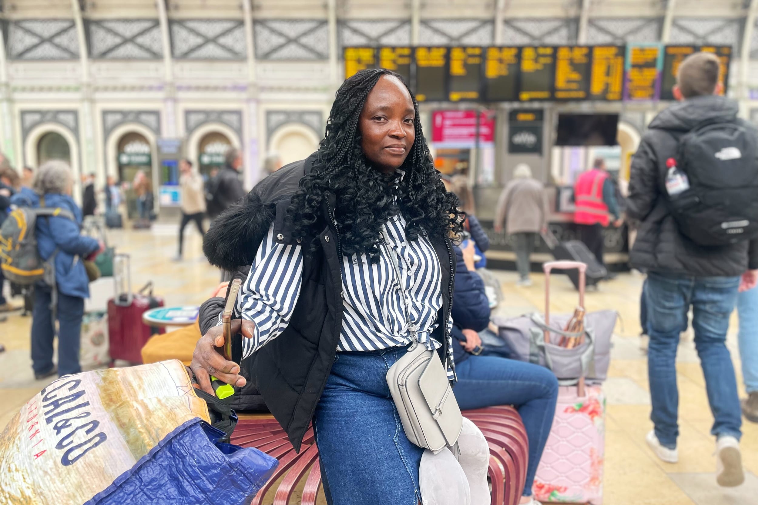 Rail passengers at London's Paddington station on March 21, 2025.