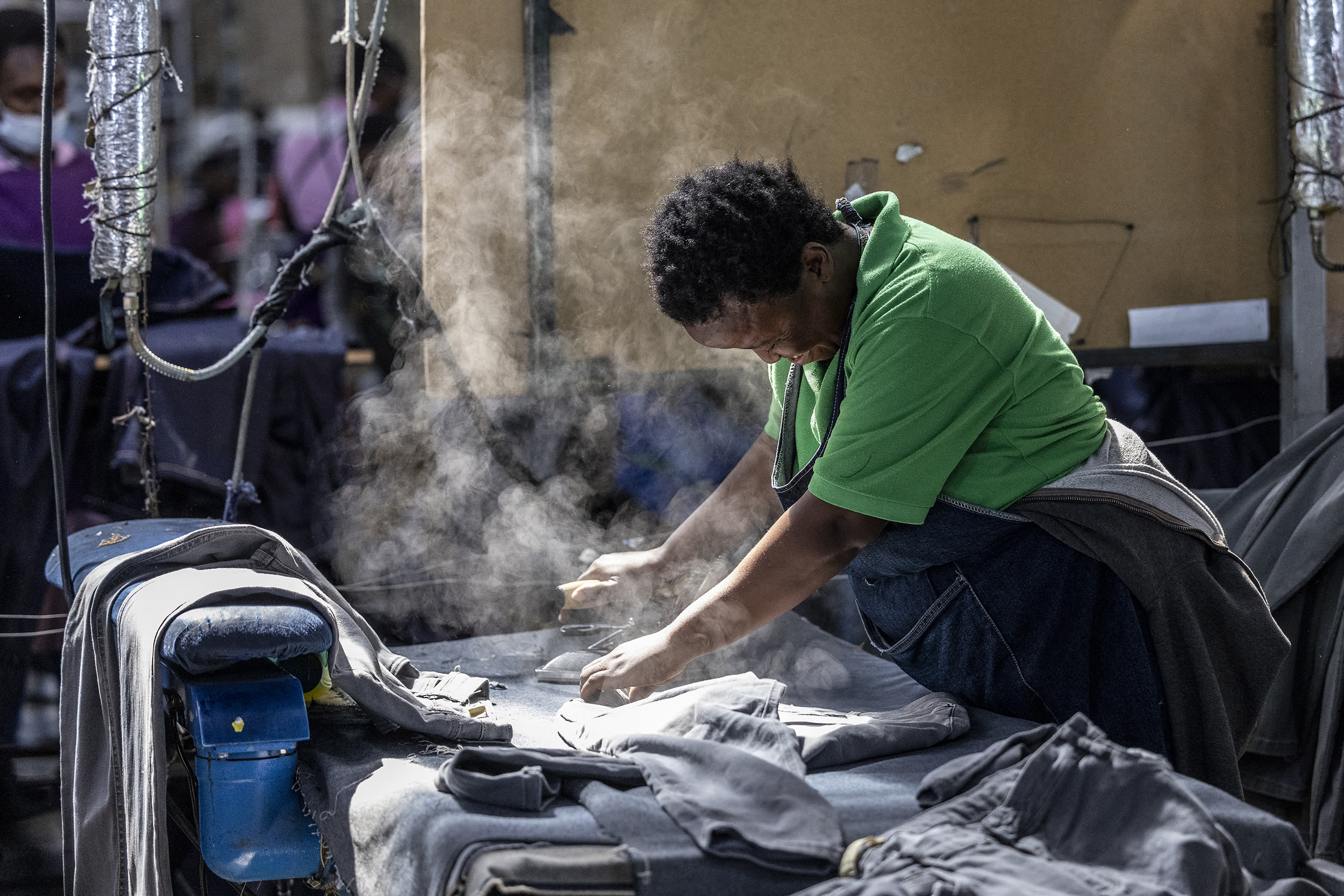 In a sweltering factory in Lesotho, rows of workers hunch over thrumming sewing machines churning out piles of denim jeans for global shoppers from this country US President Donald Trump mocked as unknown.