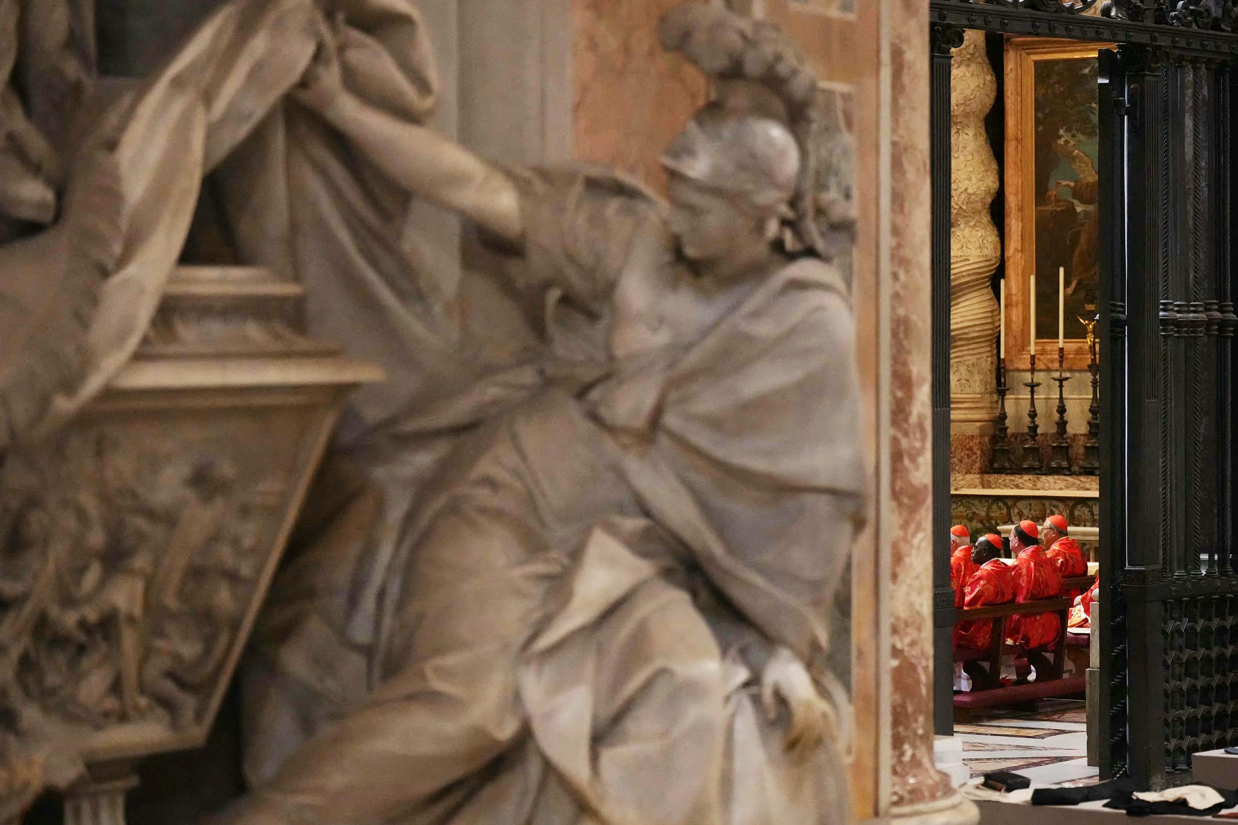 Cardinals seated in a chapel prior to the start of the conclave