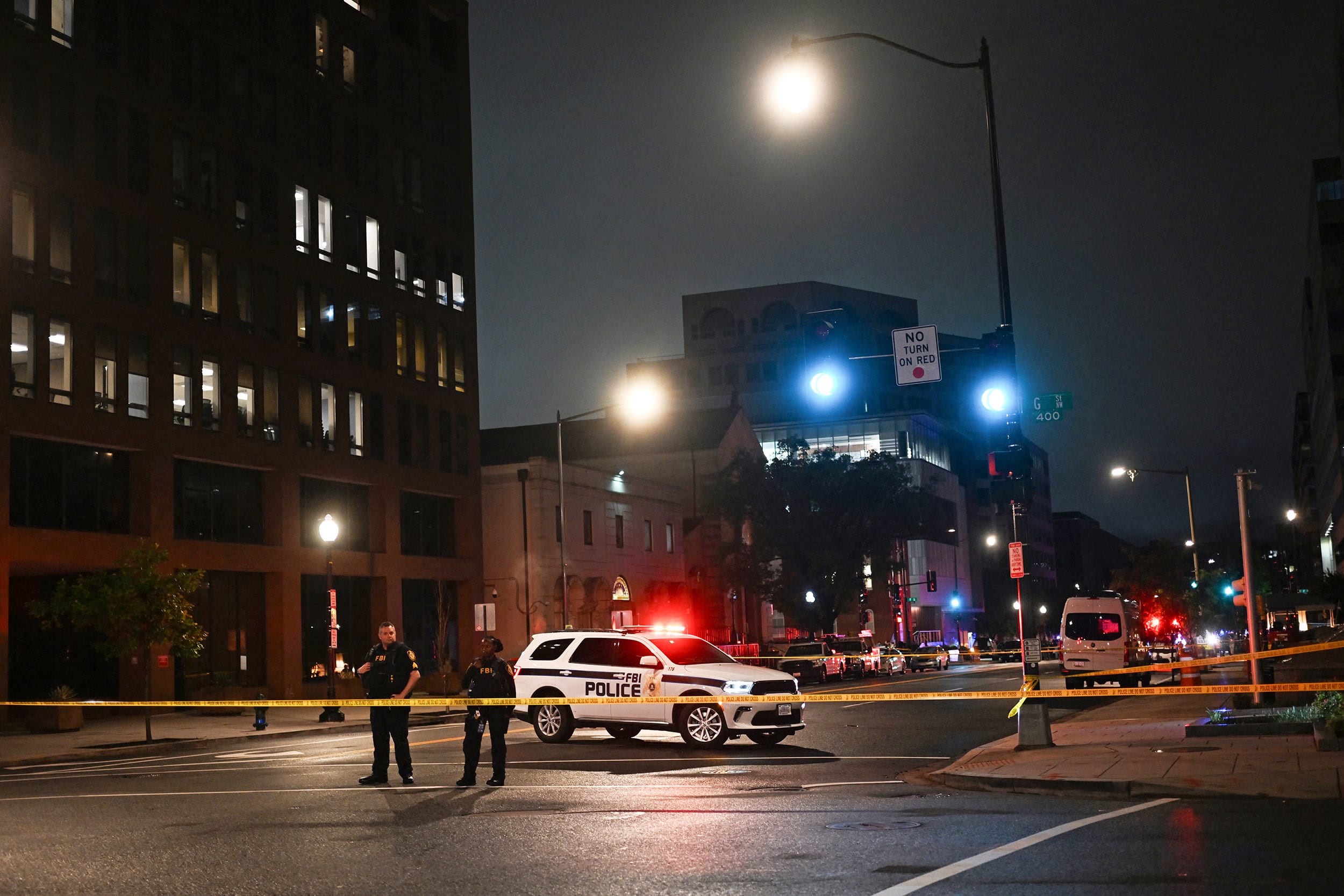 FBI agents cordon off the scene outside the Capital Jewish Museum
