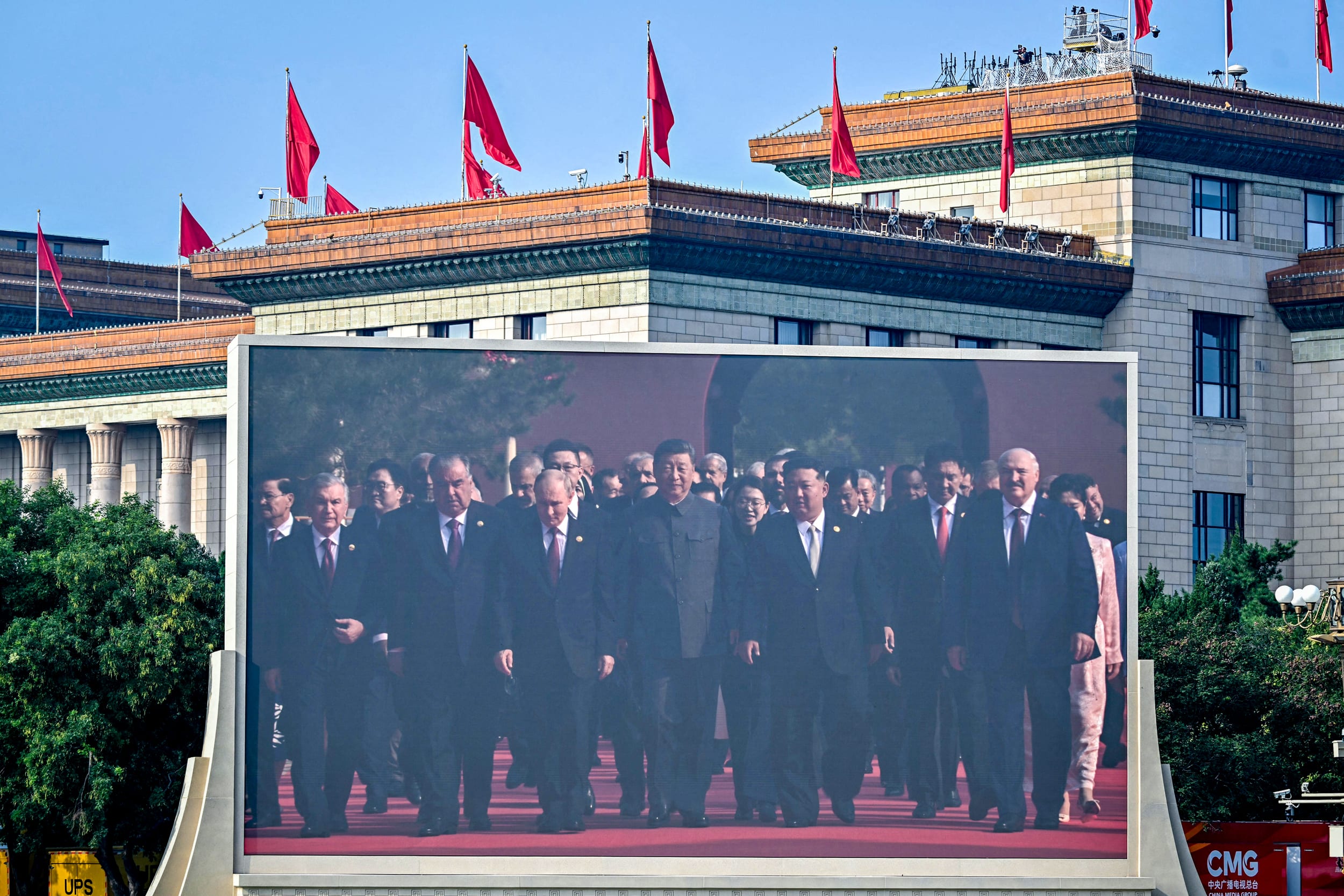 China's President Xi Jinping walks alongside Russia's President Vladimir Putin and North Korea's leader Kim Jong Un.