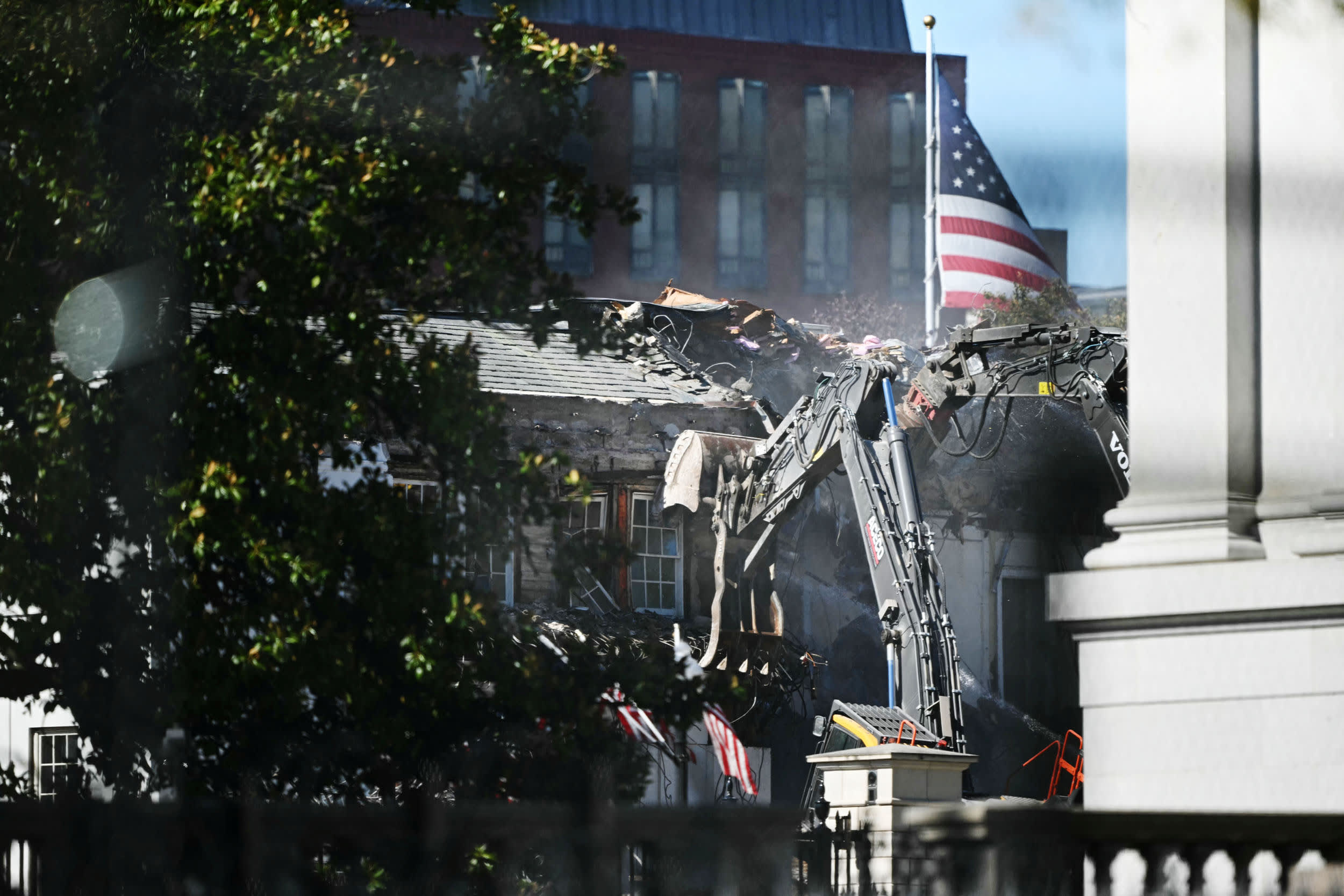 Heavy machinery tears down a section of the East Wing of the White House 