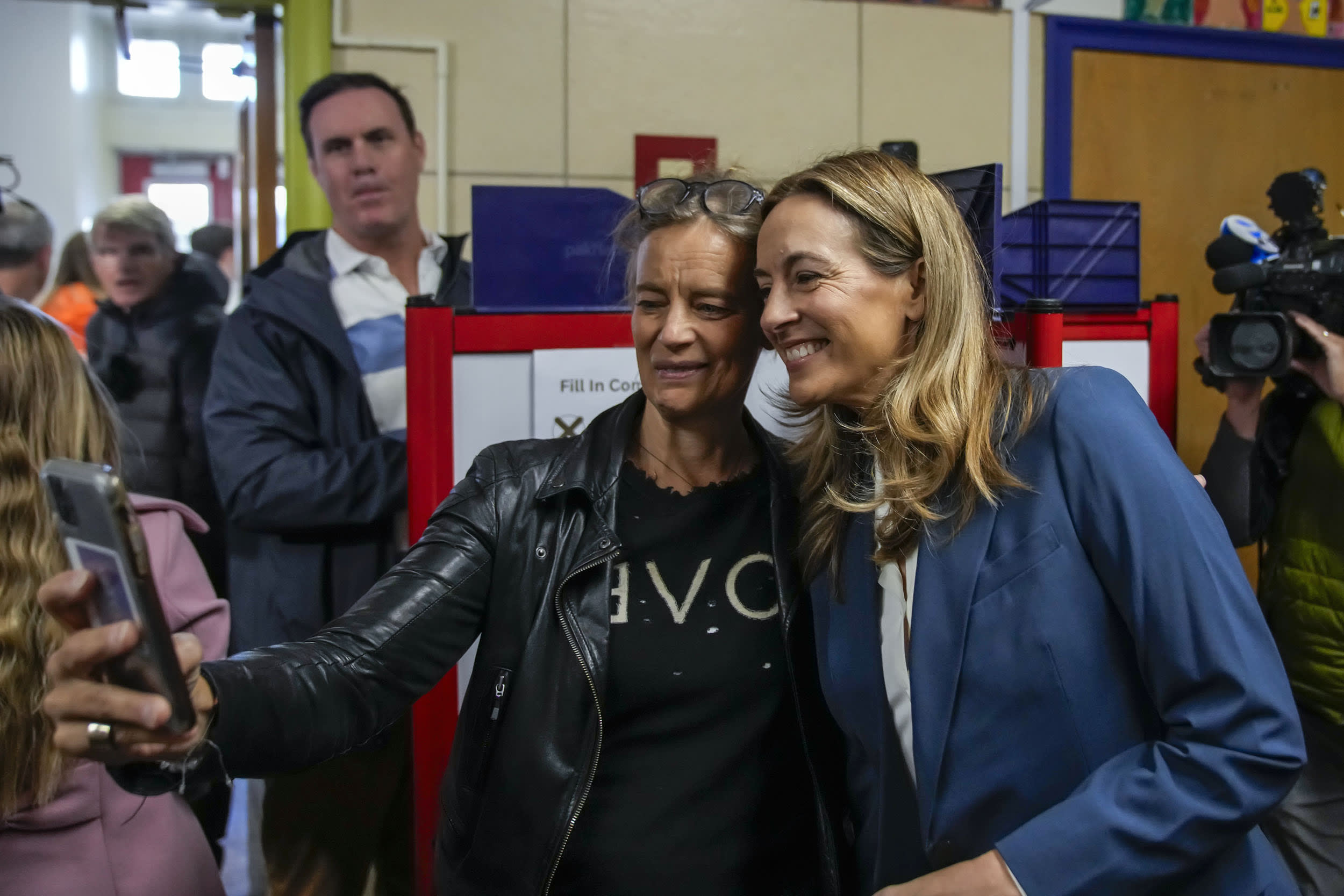 Rep. Mikie Sherrill, New Jersey Democratic gubernatorial candidate, poses with a supporter after casting her vote on Nov. 4, 2025 in Montclair, N.J. 