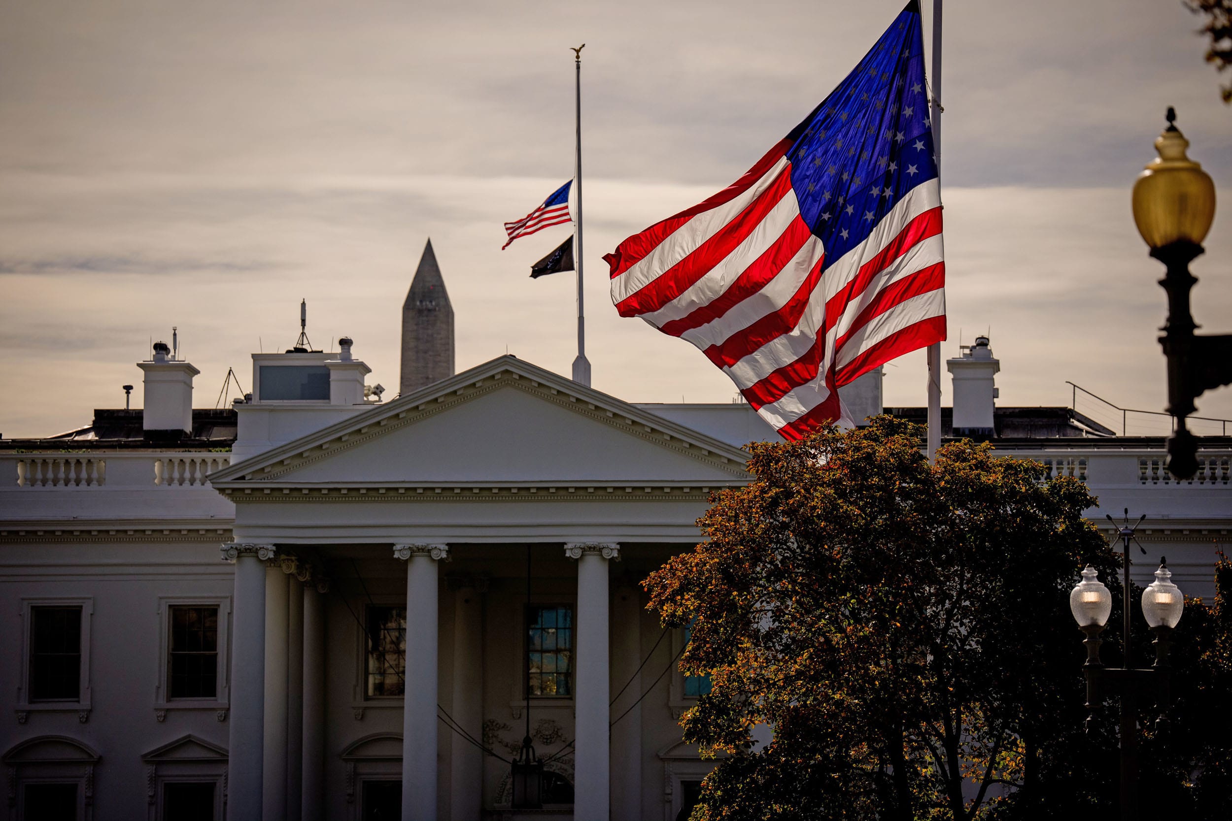 The U.S. flag flies at half-staff at the White House on Nov. 4, 2025, to honor former Vice President Dick Cheney.