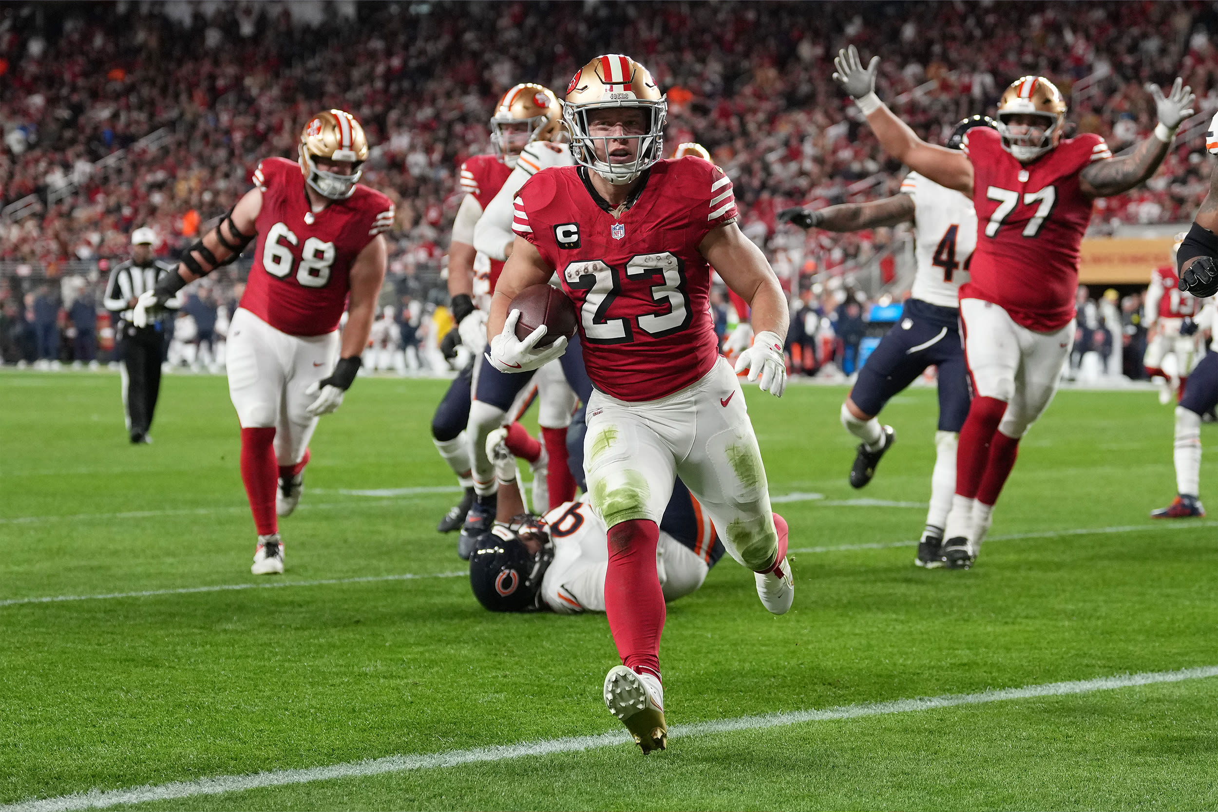 Christian McCaffrey #23 of the San Francisco 49ers runs for a touchdown against the Chicago Bears during the second quarter of the game at Levi's Stadium on December 28, 2025 in Santa Clara, California.