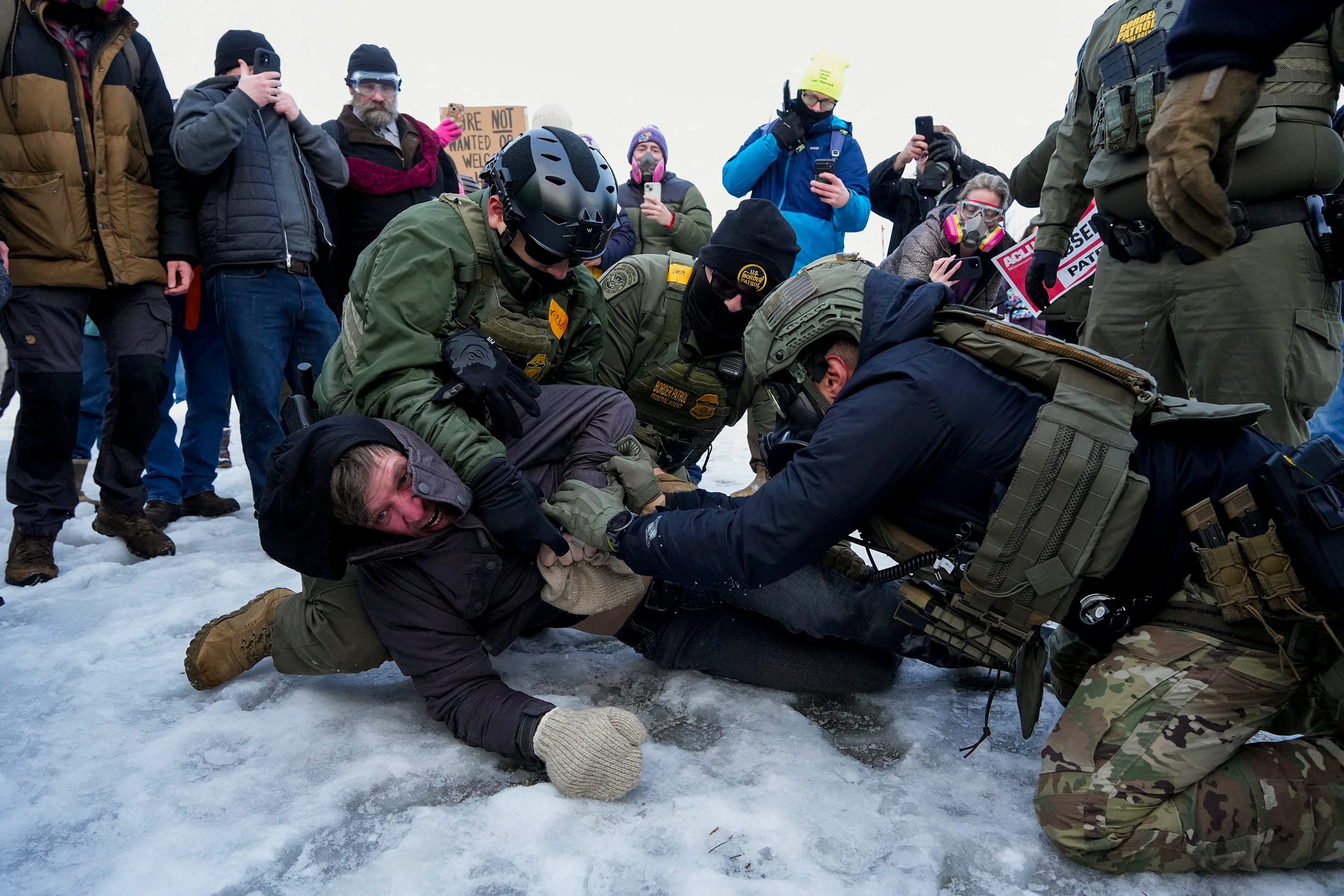 Border Patrol federal agents detain a demonstrator.