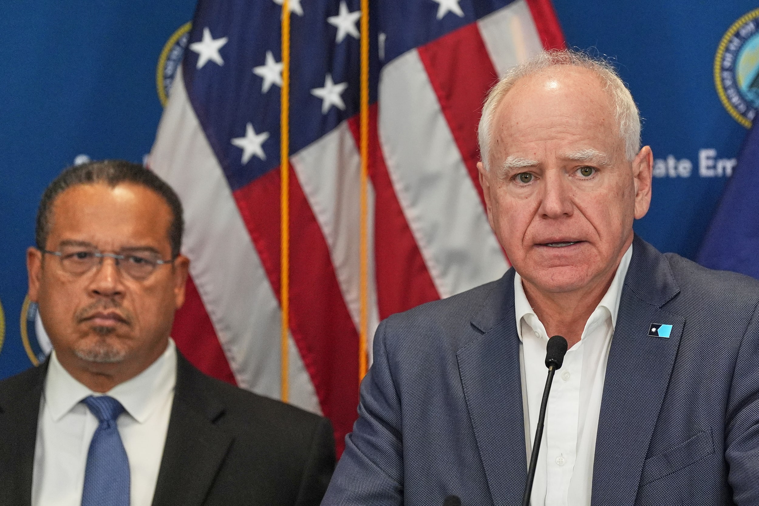 Minnesota Gov. Tim Walz, right, and Attorney General Keith Ellison discuss the shooting of Alex Pretti during a news conference in Blaine, Minn., Sunday, Jan. 25, 2026.