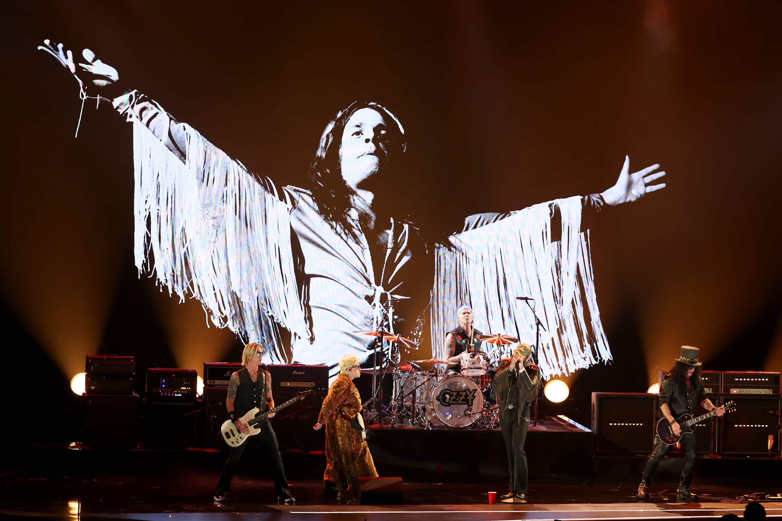 An image of Ozzy Osbourne is projected against a stage backdrop during a performance at the Grammy awards.