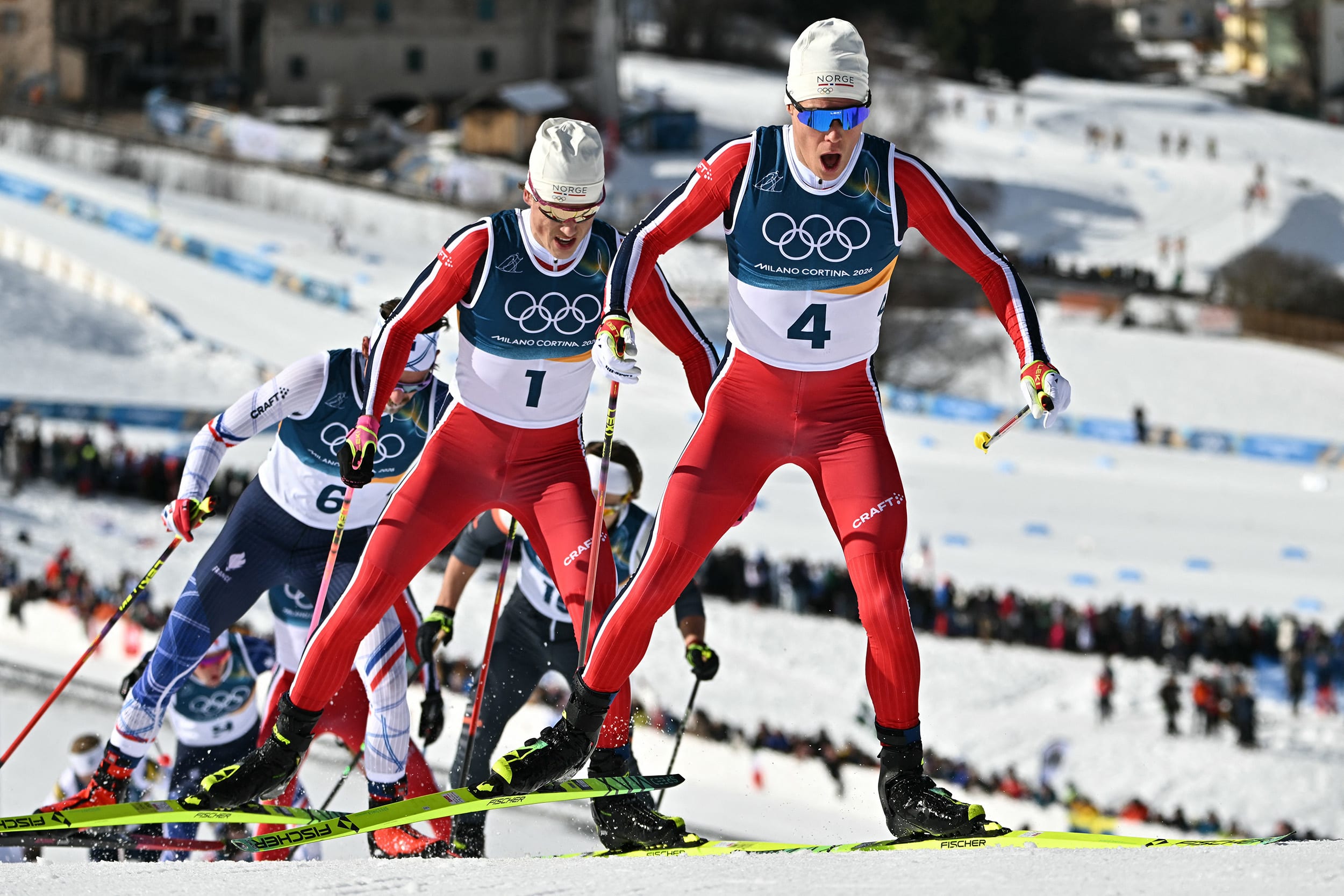 Norway's Martin Loewstroem Nyenget and Johannes Hoesflot Klaebo during the men's cross country 10km + 10km skiathlon in Lago di Teseroon Feb. 8, 2026.