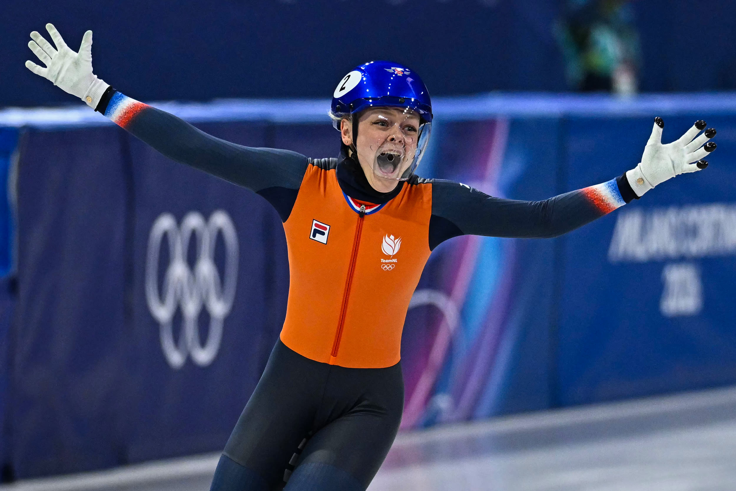 Netherlands' Xandra Velzeboer short track speed skating celebrates after winning gold.